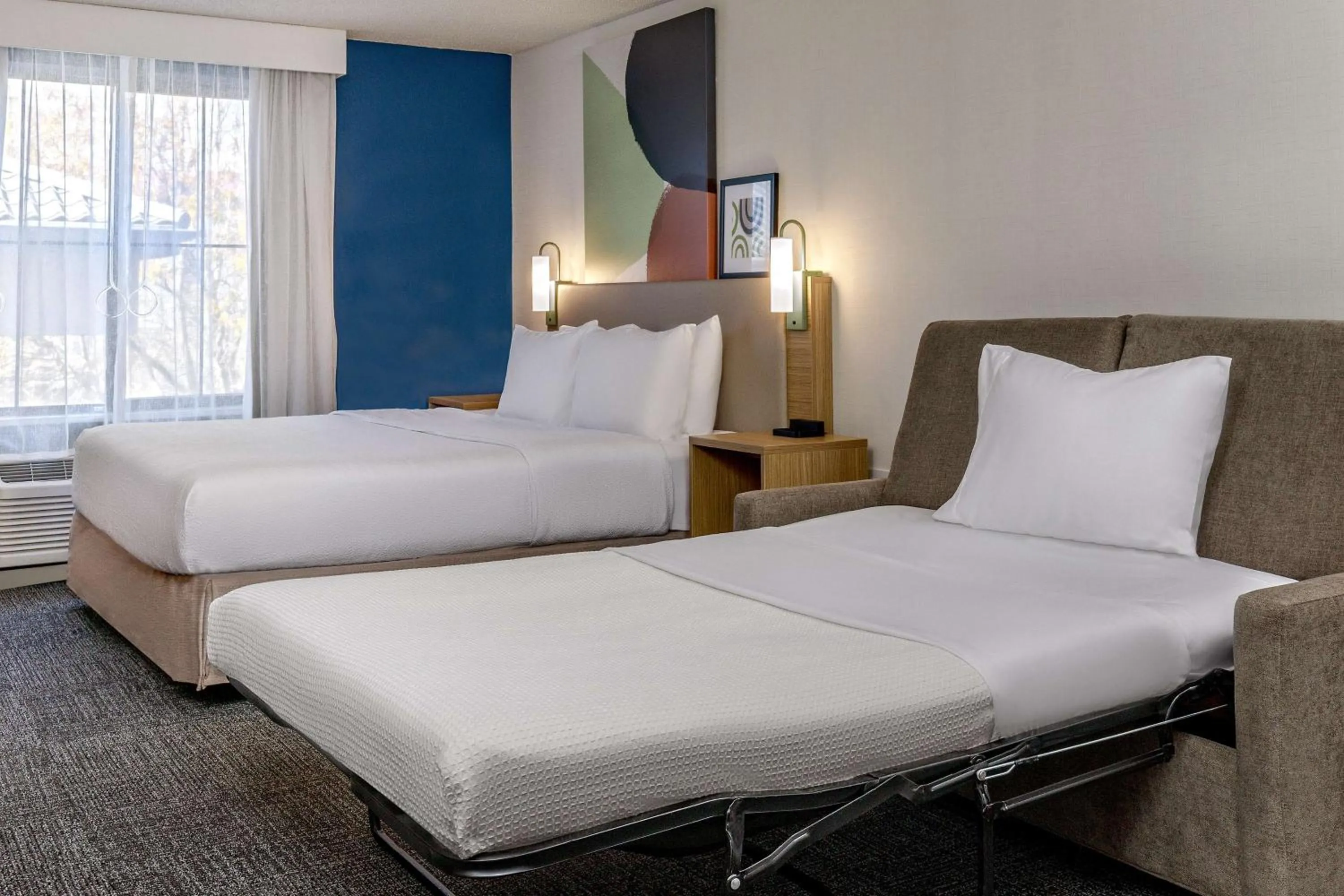 Living room, Bed in Spark by Hilton Denver International Airport