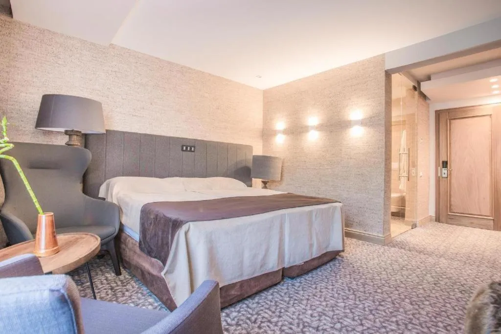 Bed in Alpin Resort Hotel