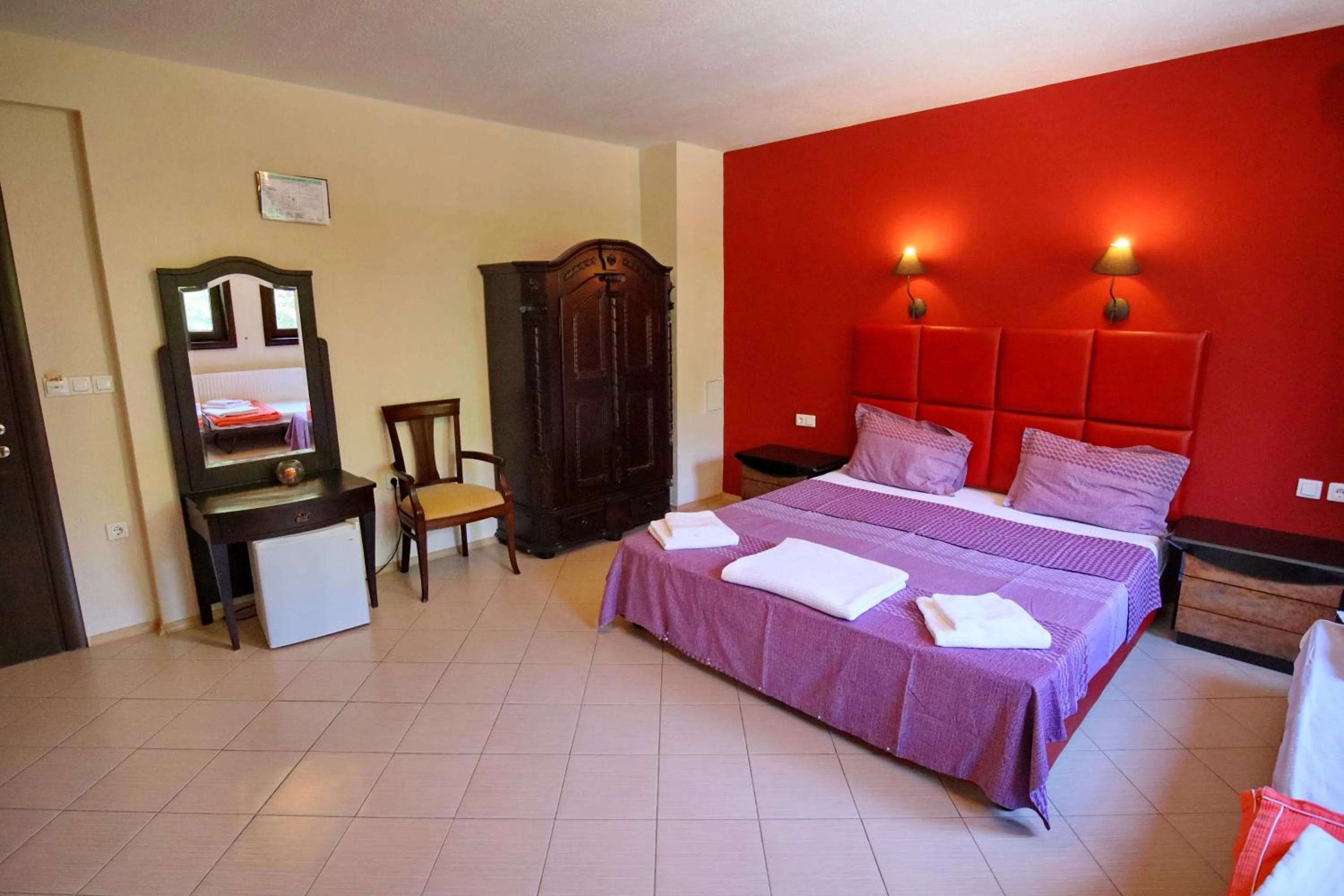 Bed in Elli Greco Hotel