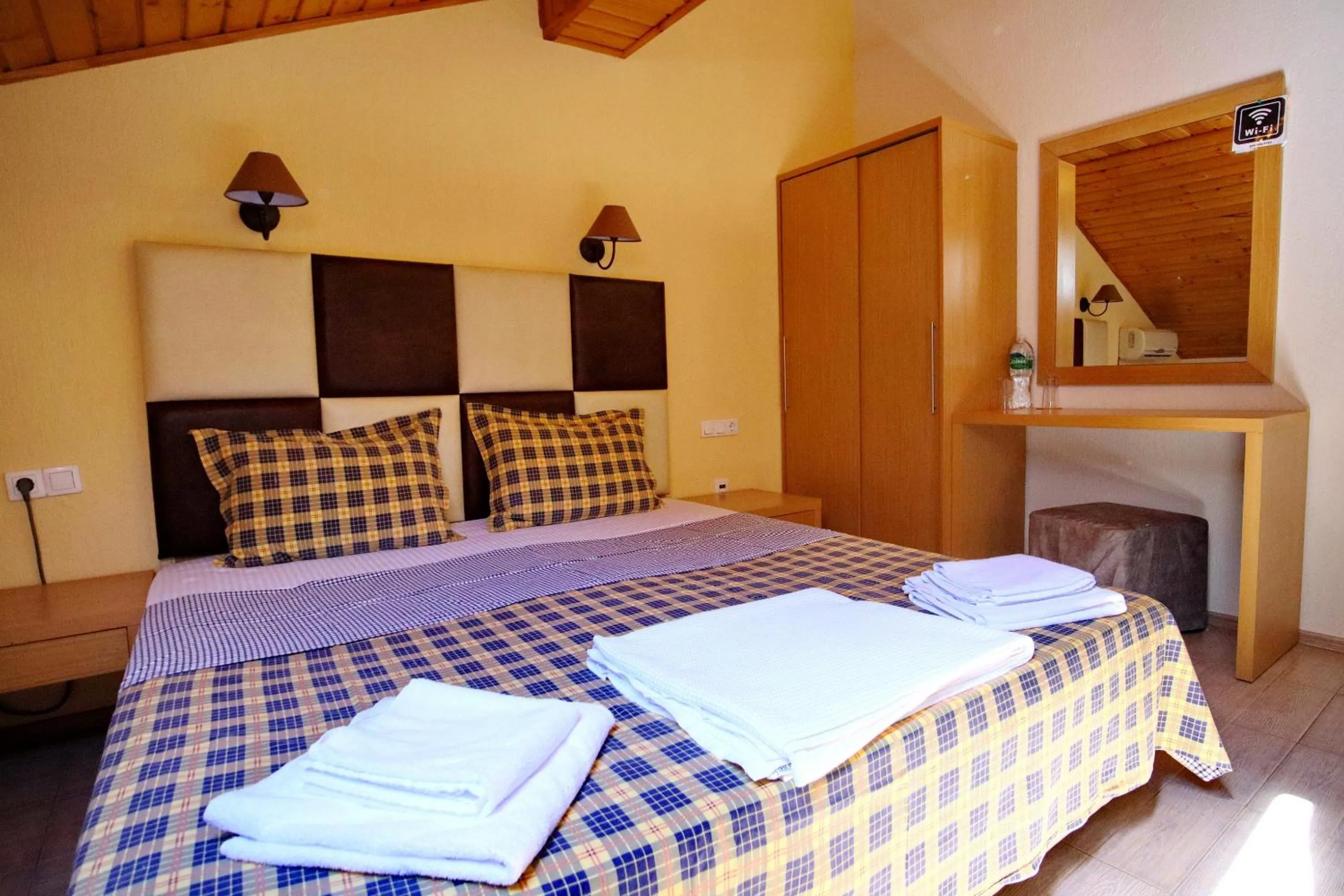 Bed in Elli Greco Hotel