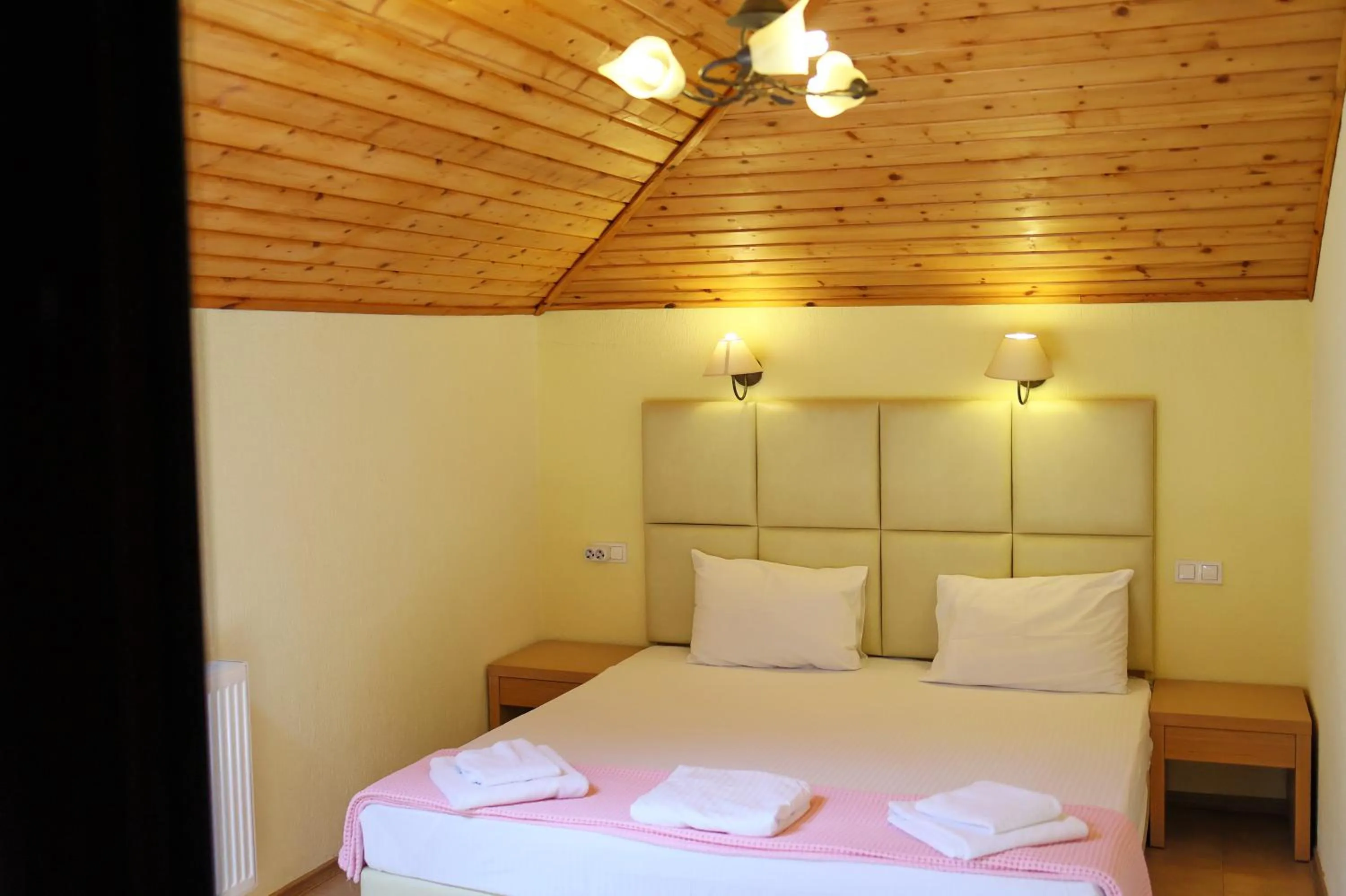 Bed in Elli Greco Hotel