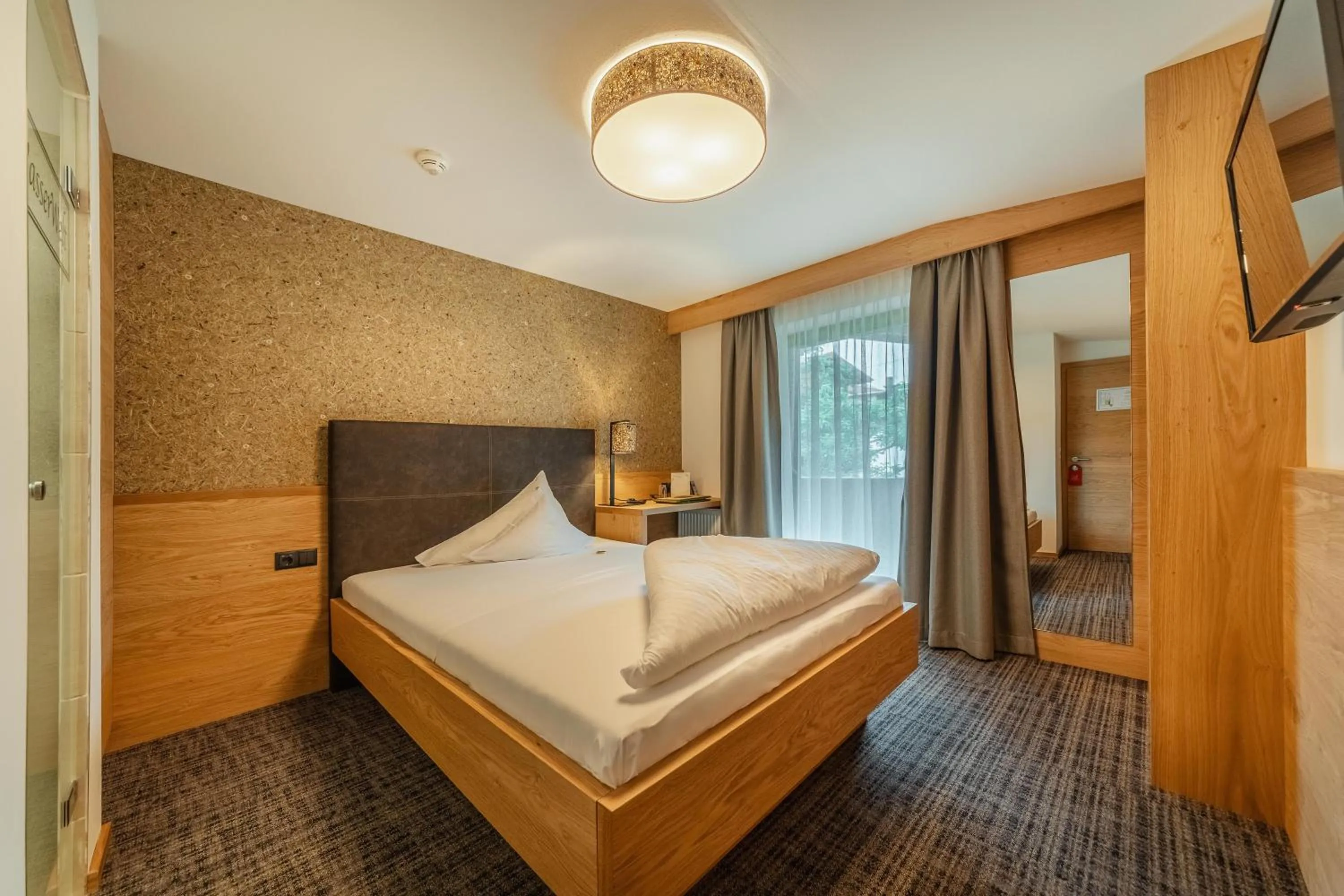 Bed in Kräuterhotel Hochzillertal