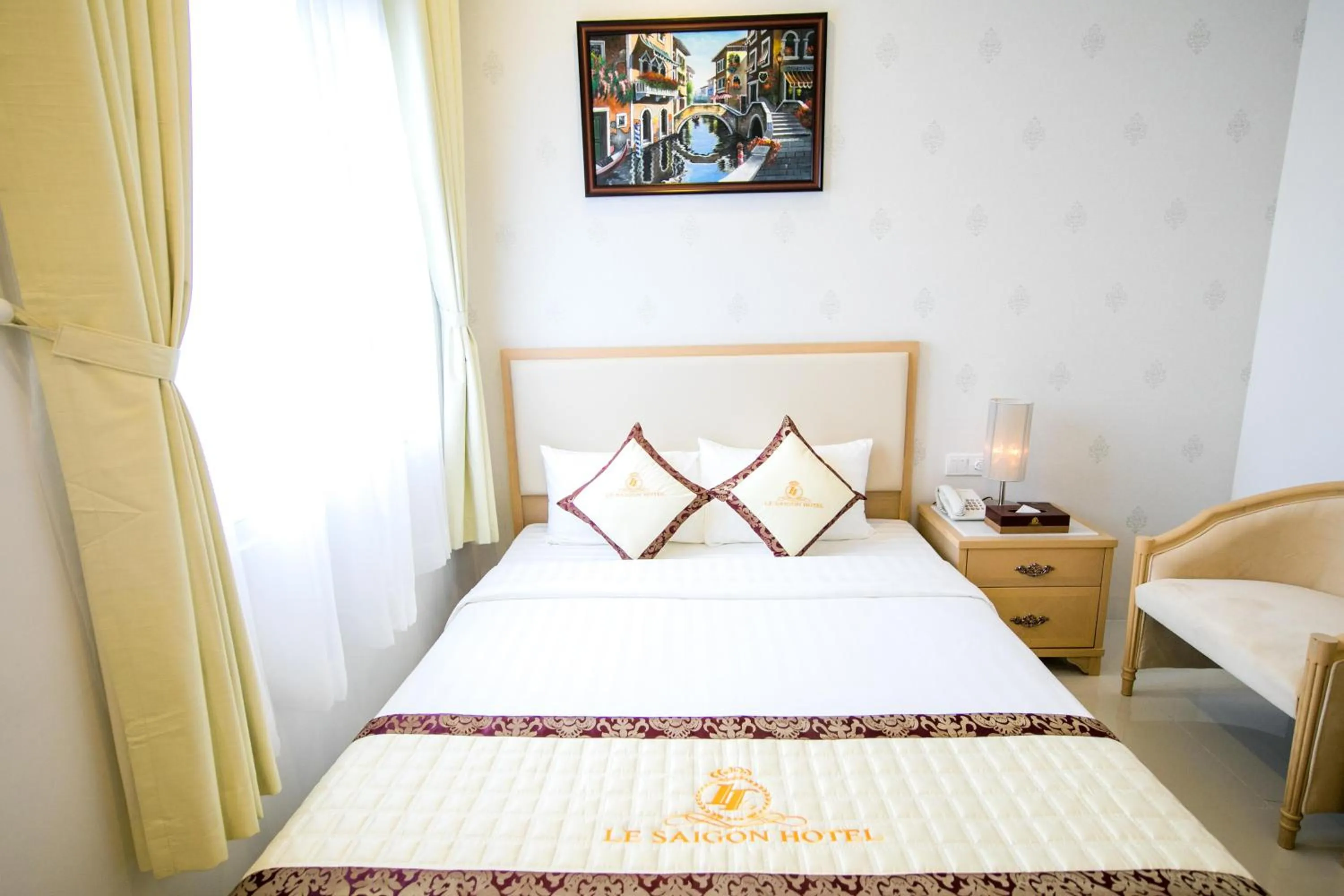 Bed in Le Saigon Hotel