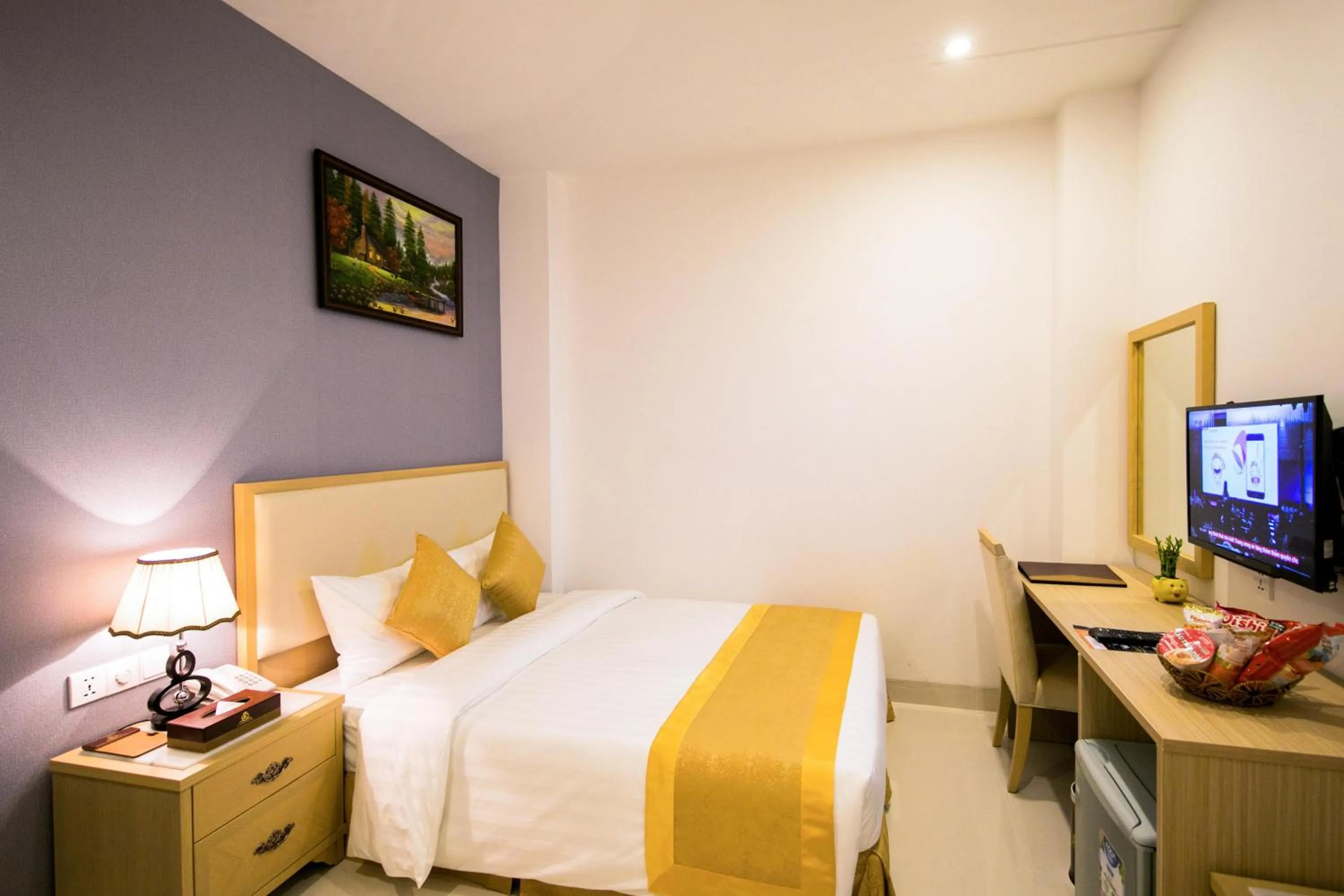 Bed in Le Saigon Hotel