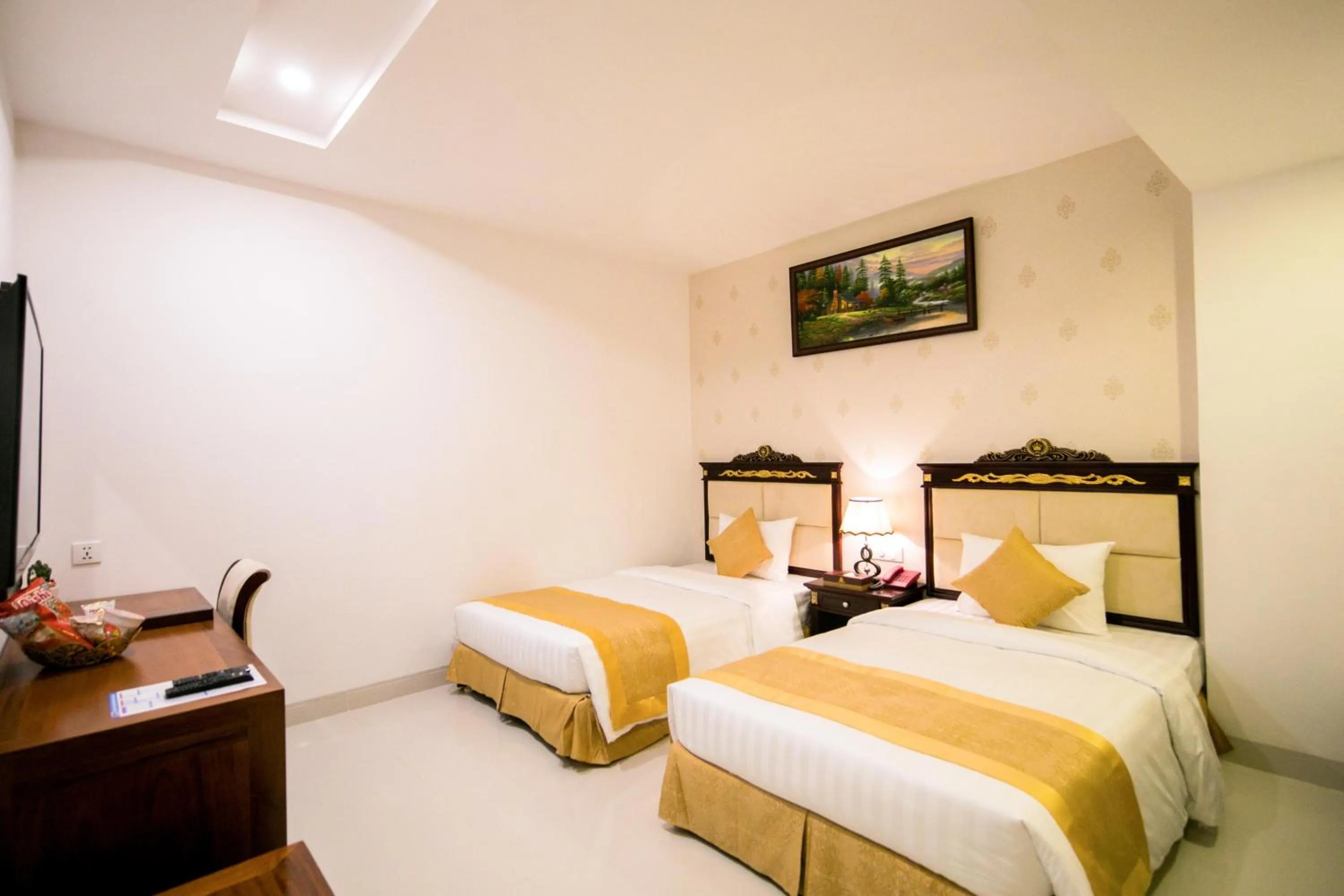 Bed in Le Saigon Hotel