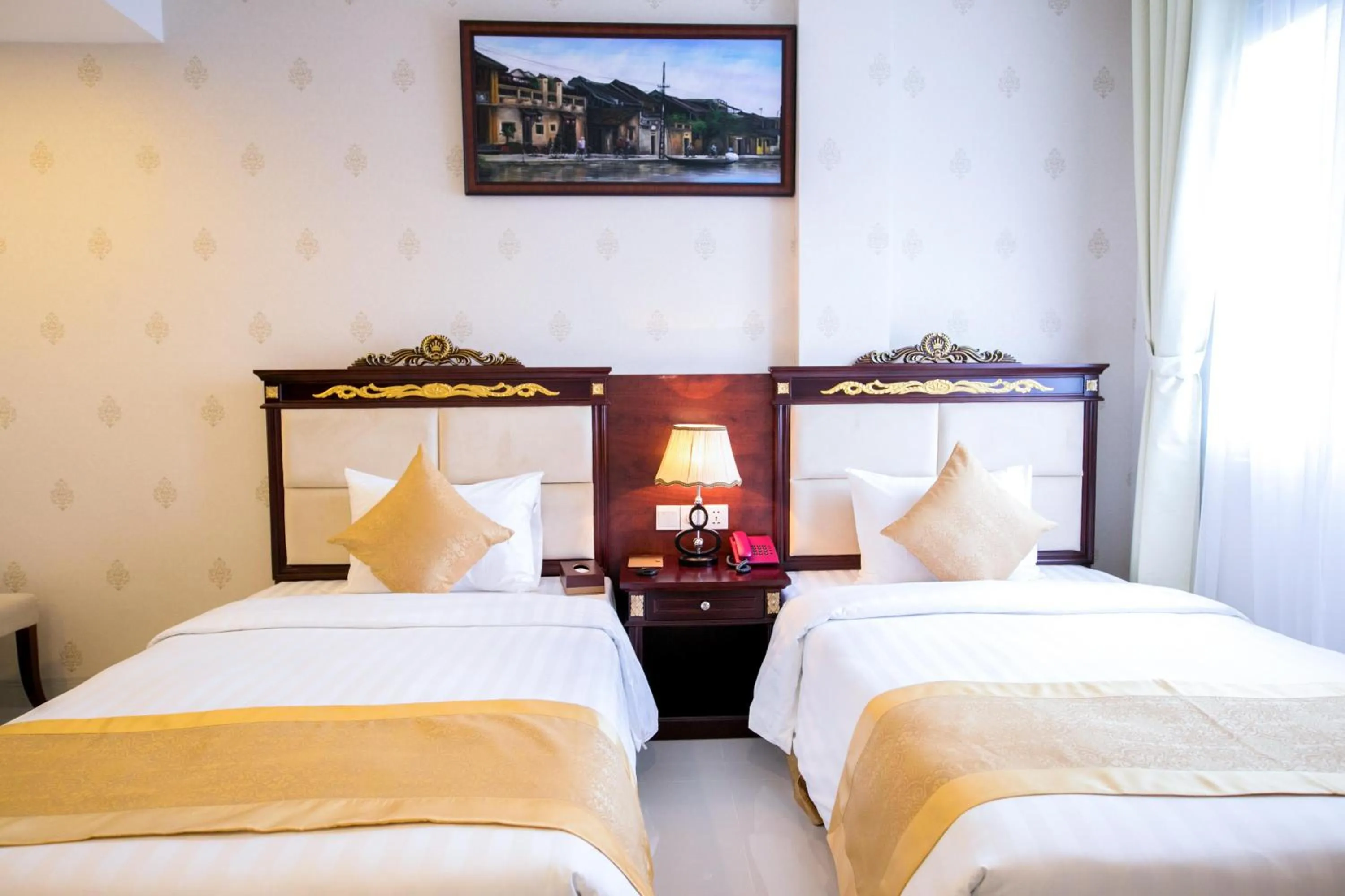 Bed in Le Saigon Hotel