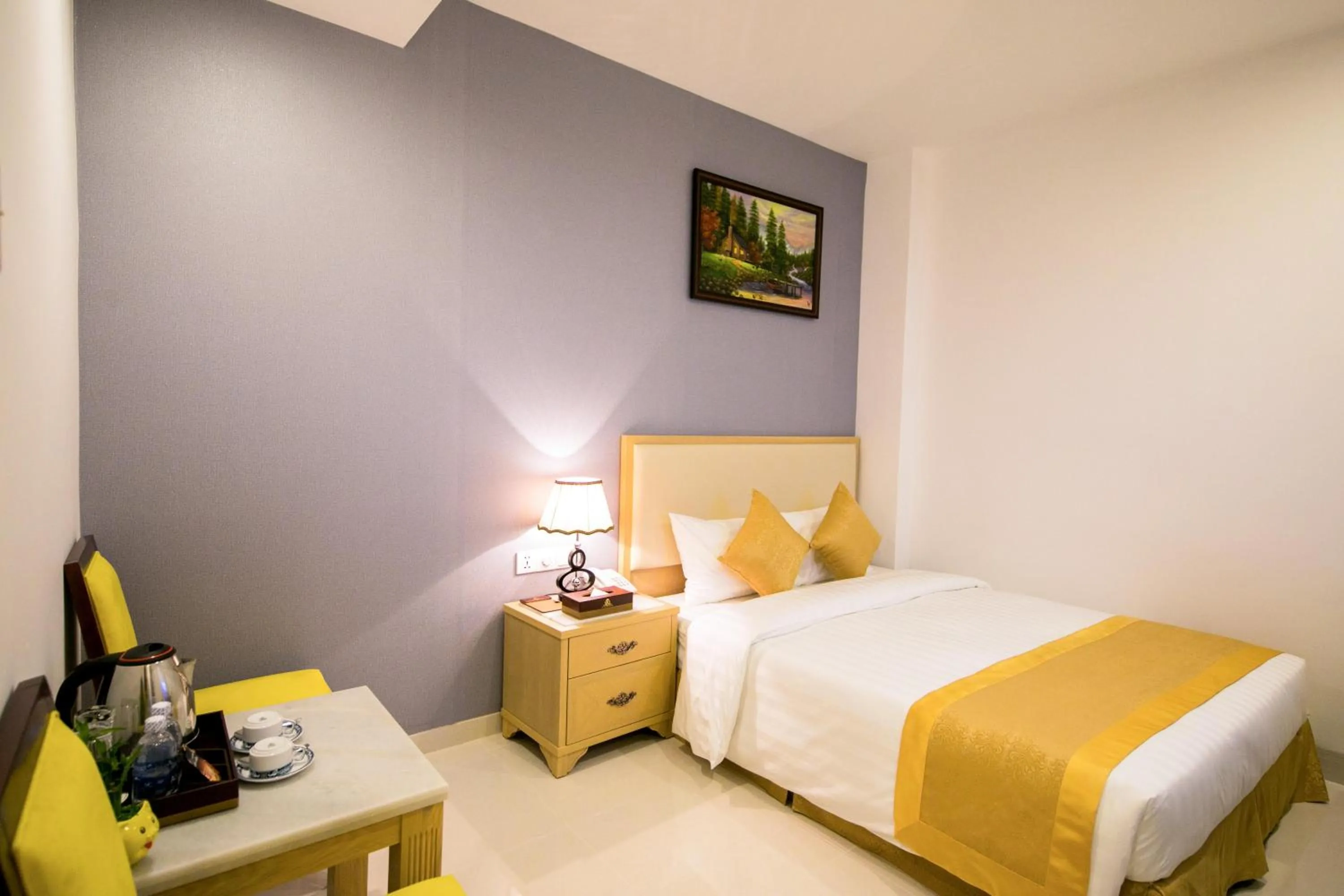 Bed in Le Saigon Hotel