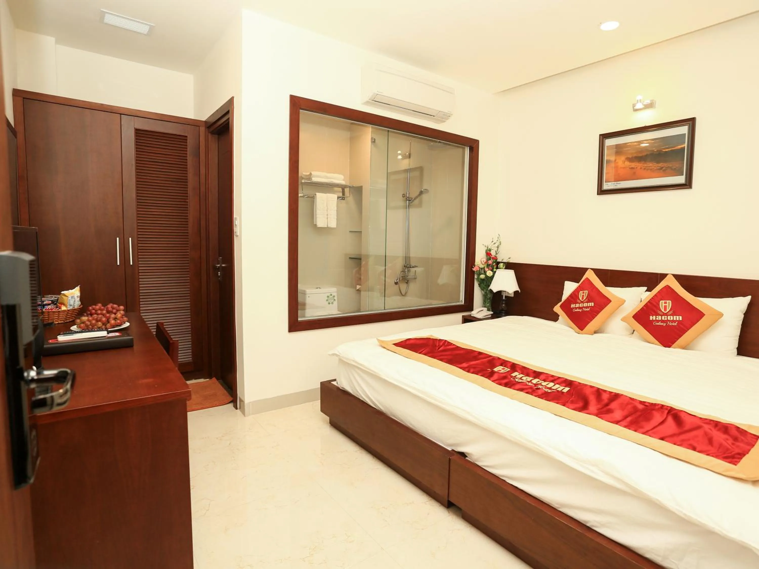 Bed in Hacom Galaxy Hotel