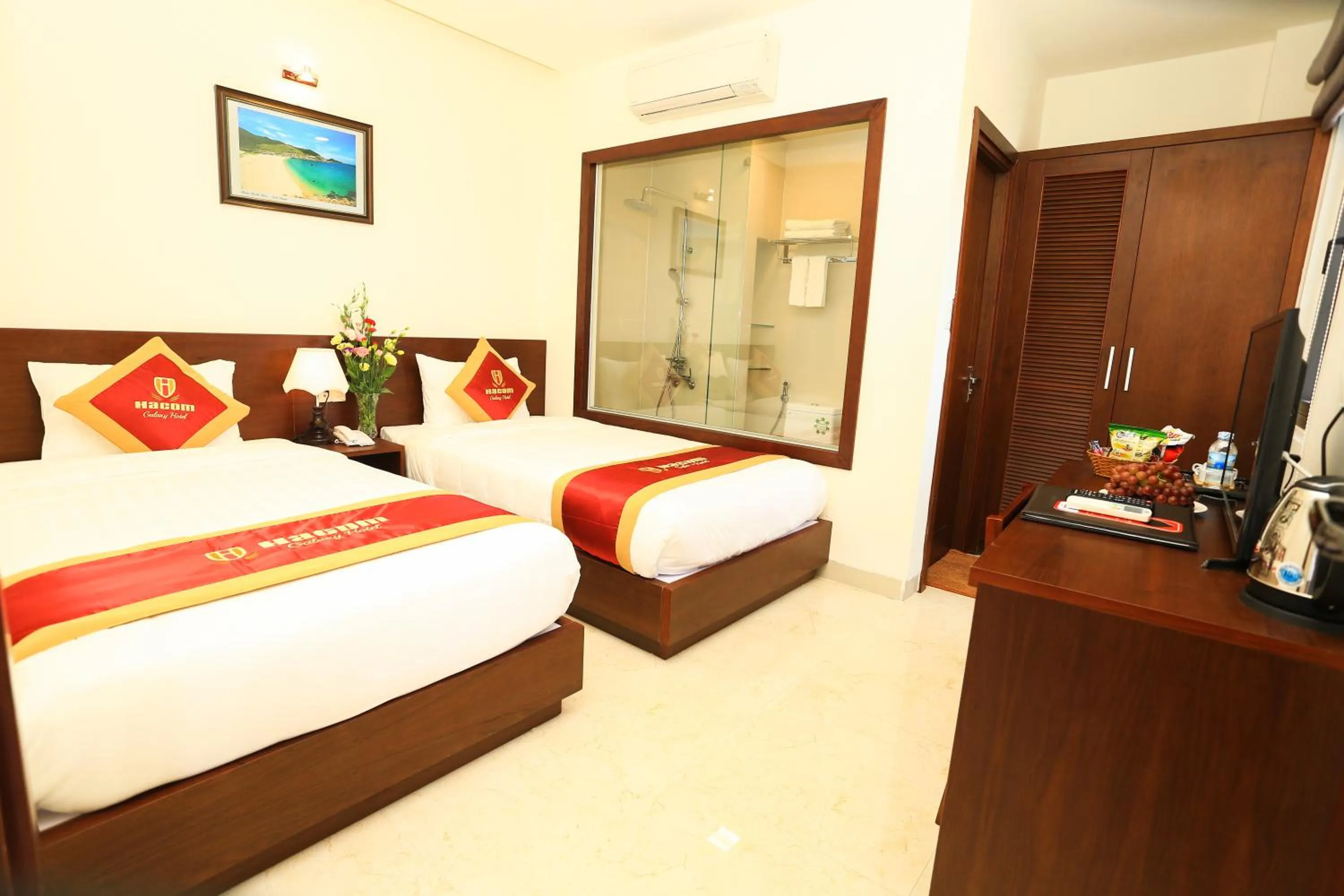 Bed in Hacom Galaxy Hotel