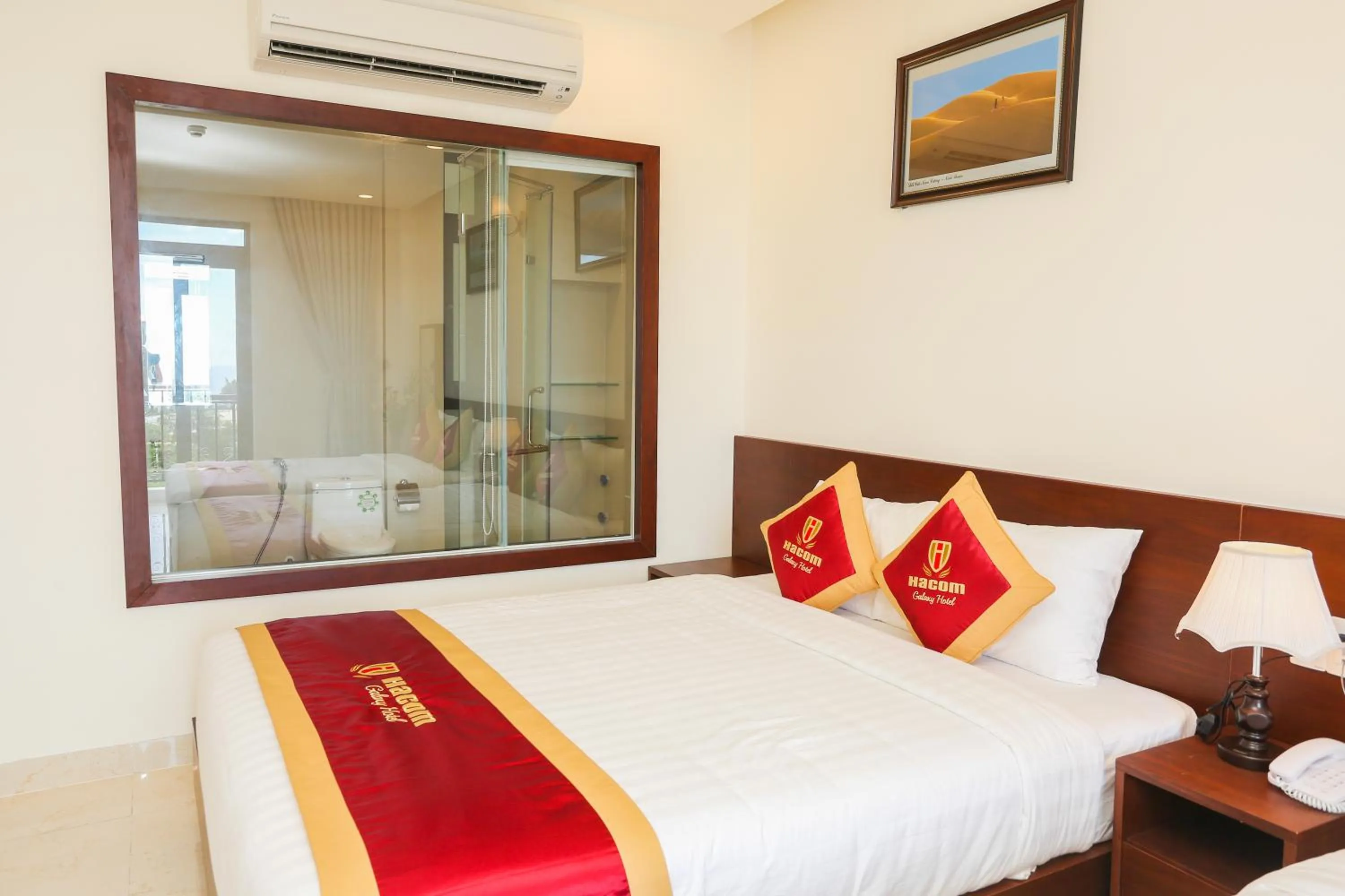 Bed in Hacom Galaxy Hotel