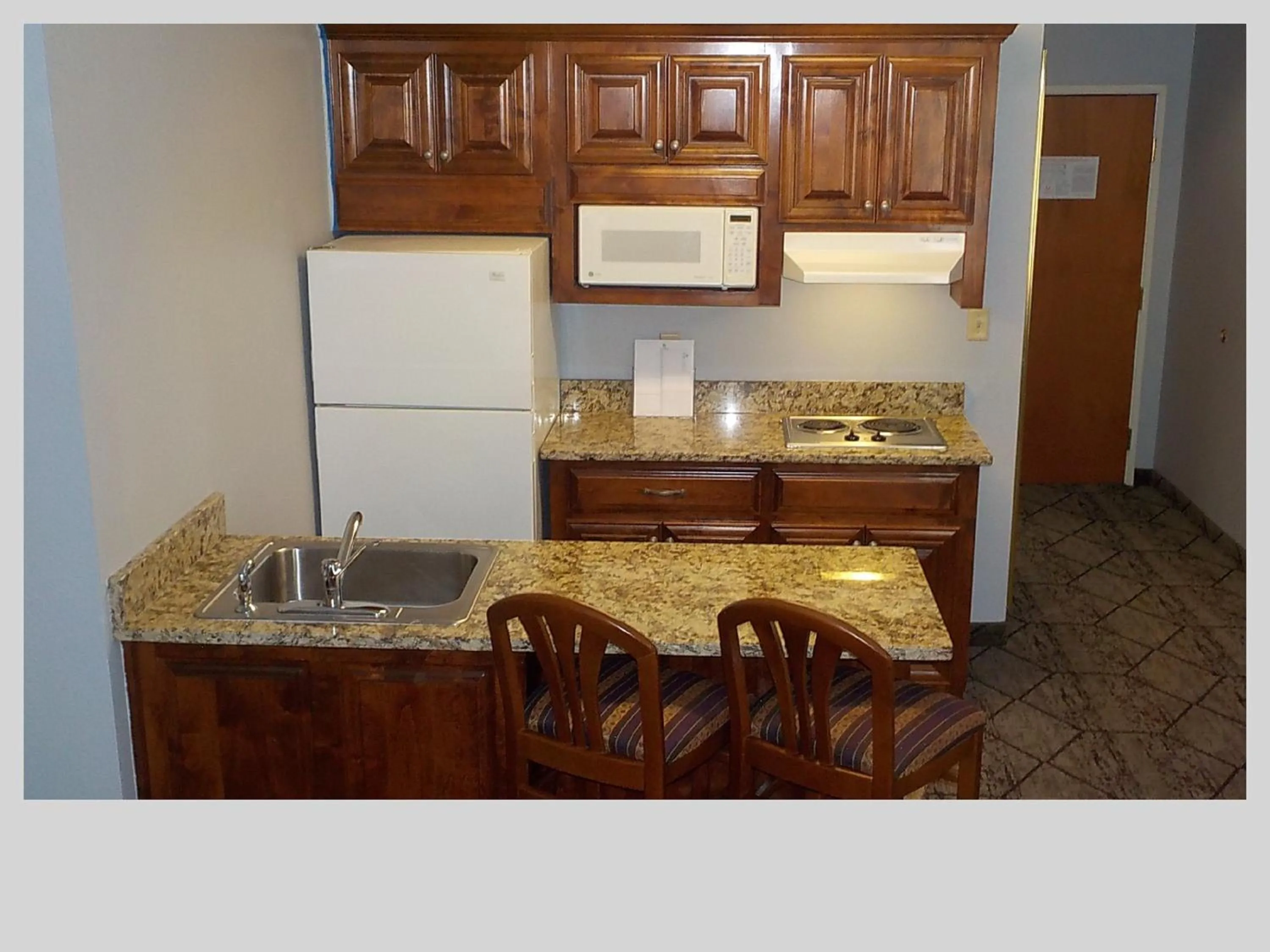 Kitchen or kitchenette in SureStay Plus Hotel by Best Western Warner Robins AFB