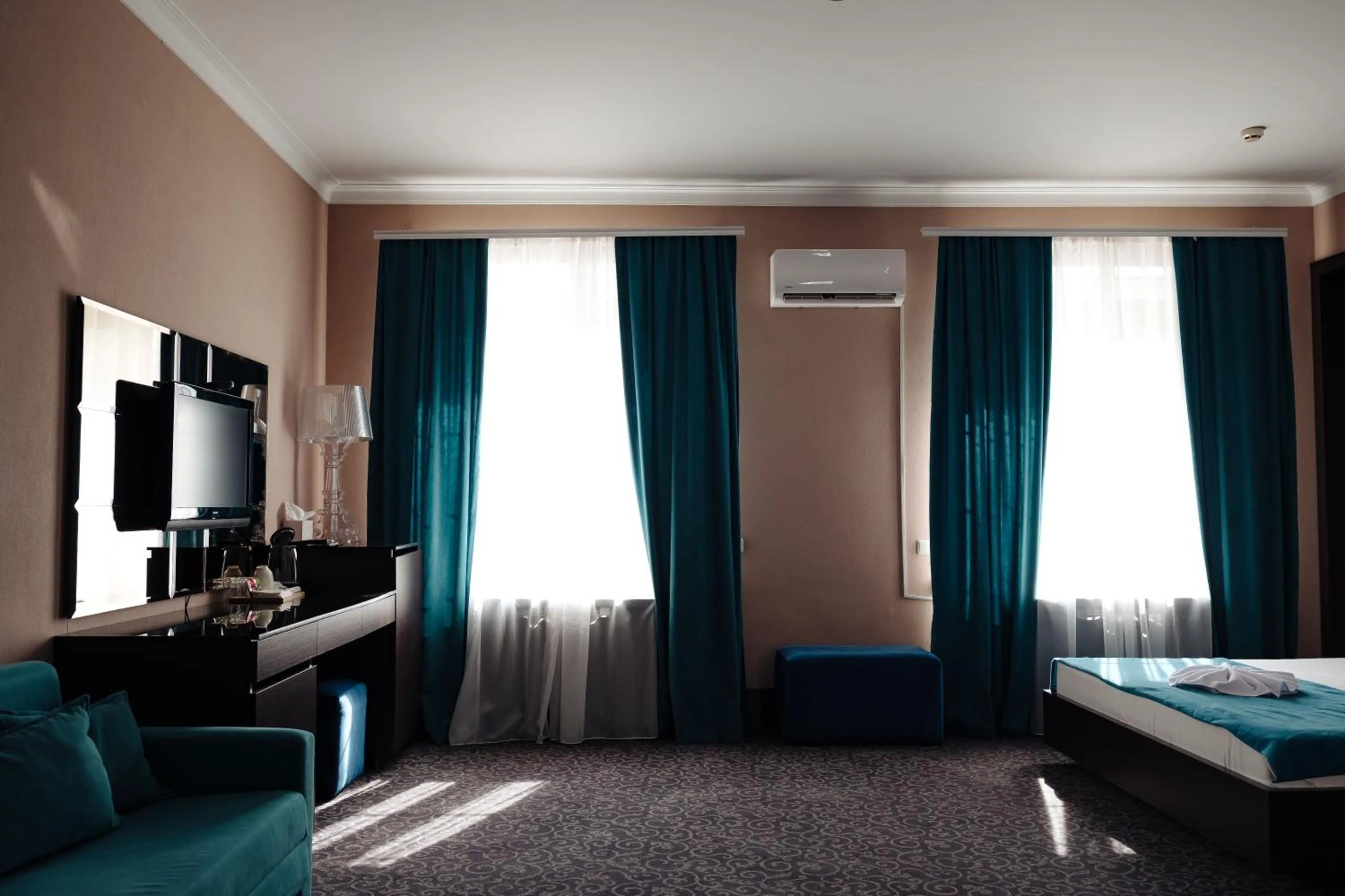 Bed in Maxim Pasha Hotel