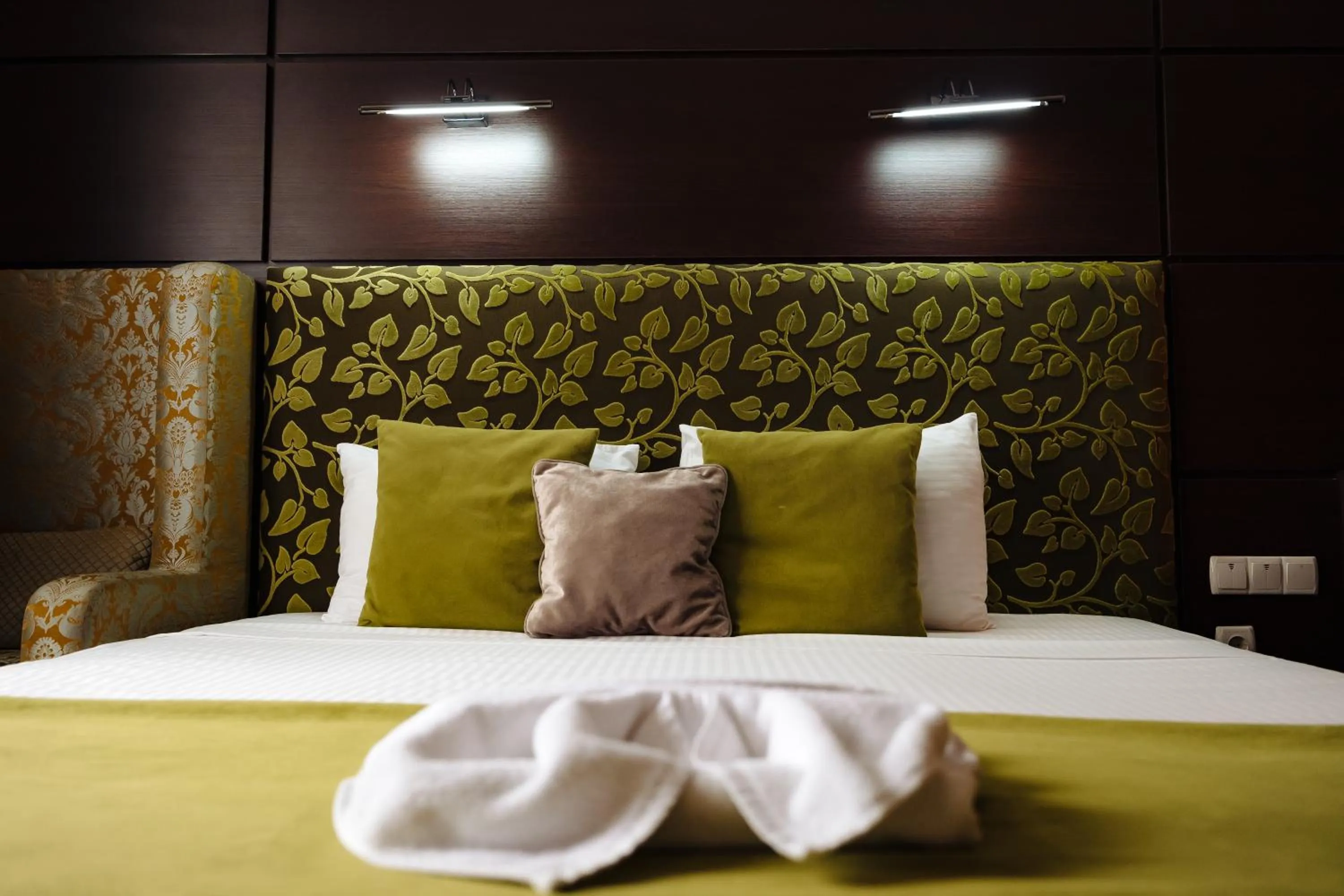 Bed in Maxim Pasha Hotel