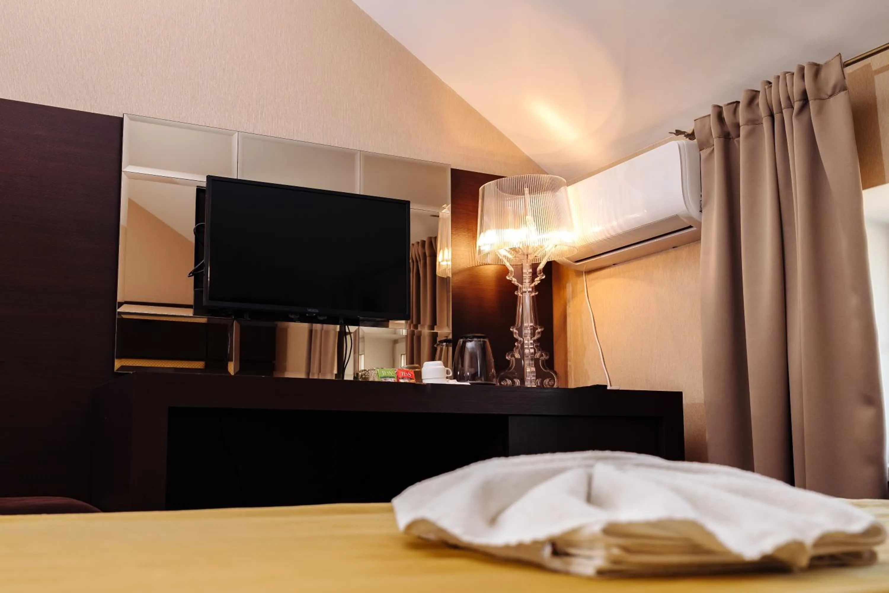 Bed in Maxim Pasha Hotel