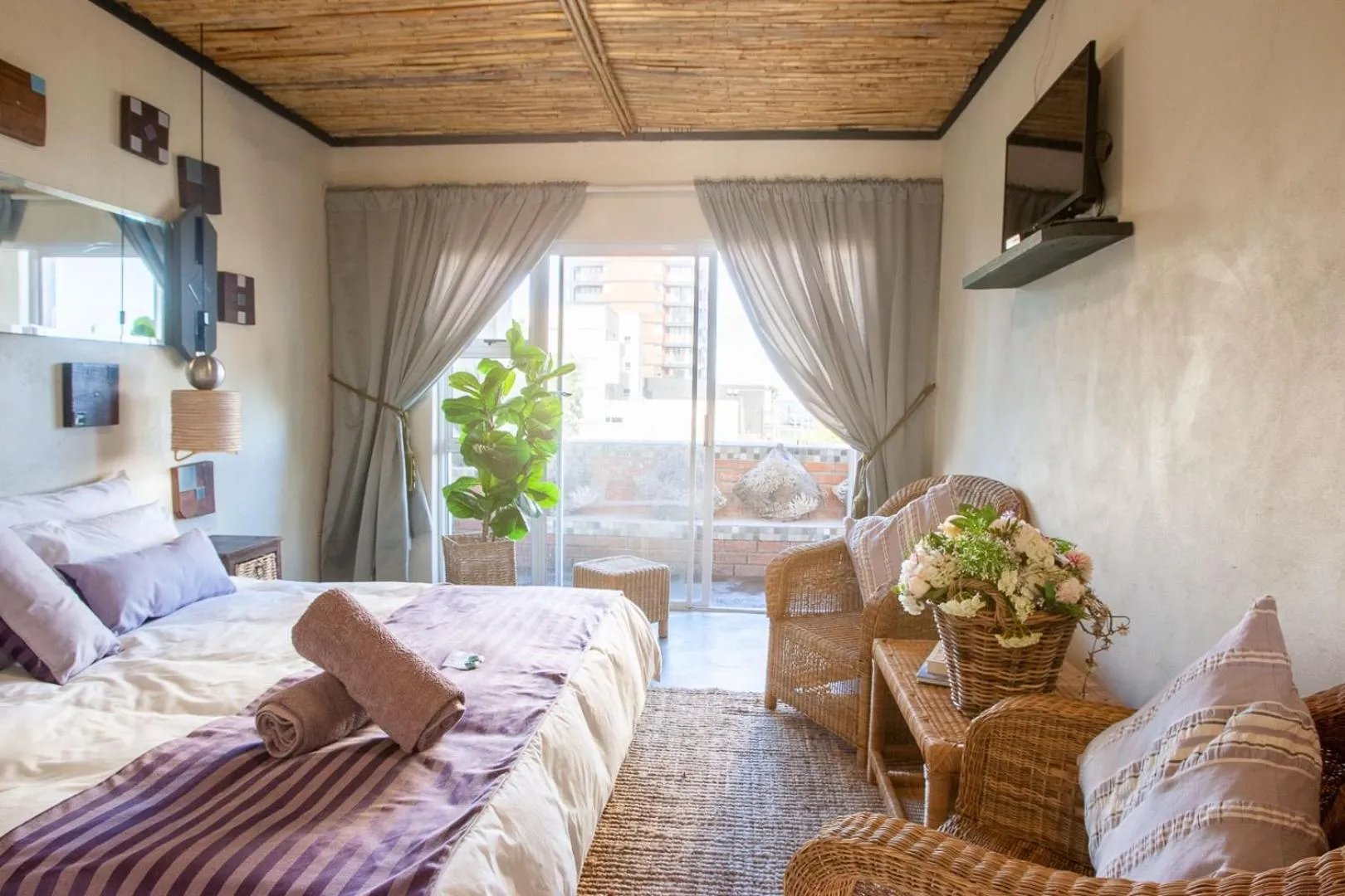 Photo of the whole room, Bed in Bedrock Guest Studios