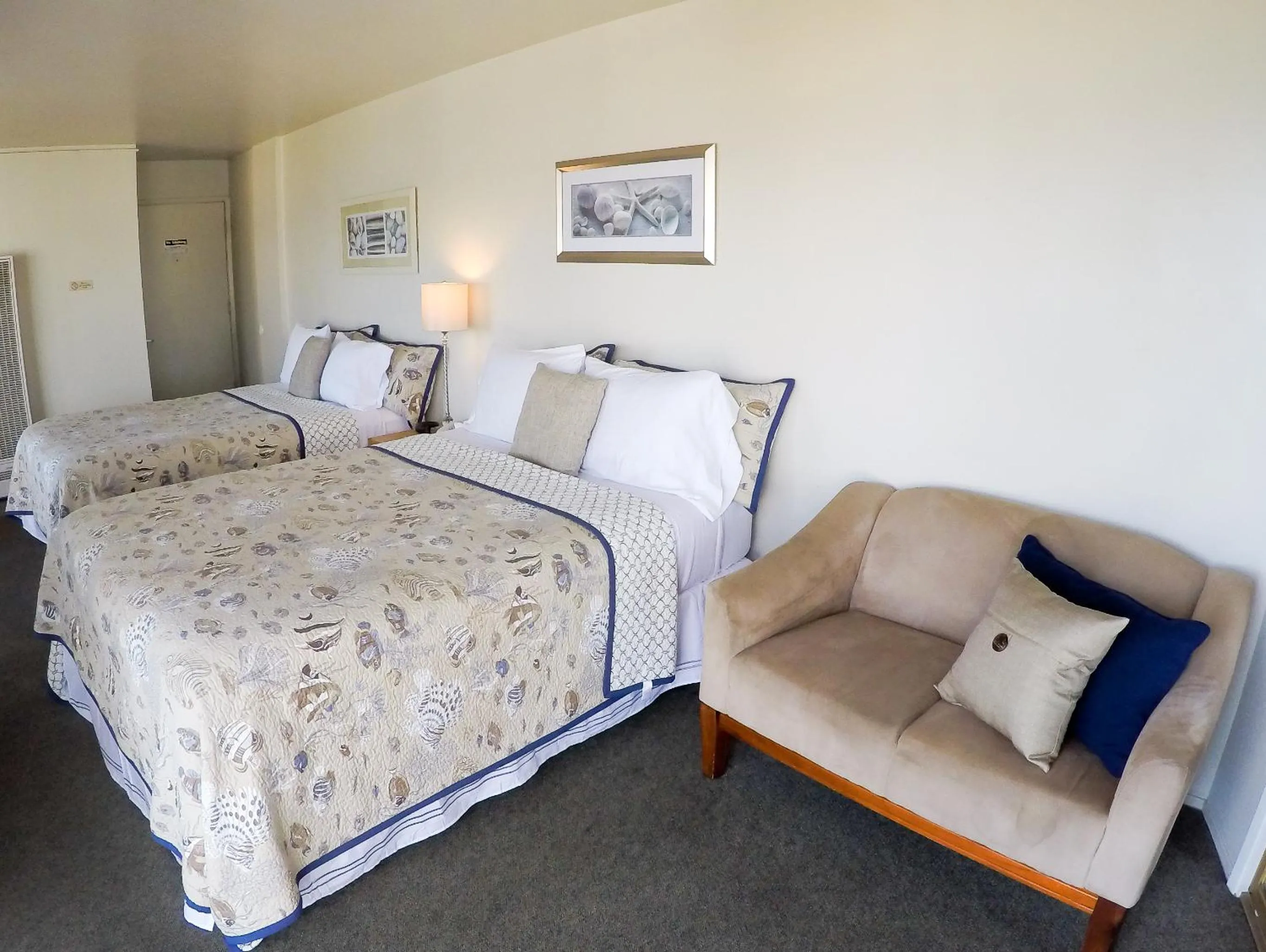 Bed in Capitola Beach Suites