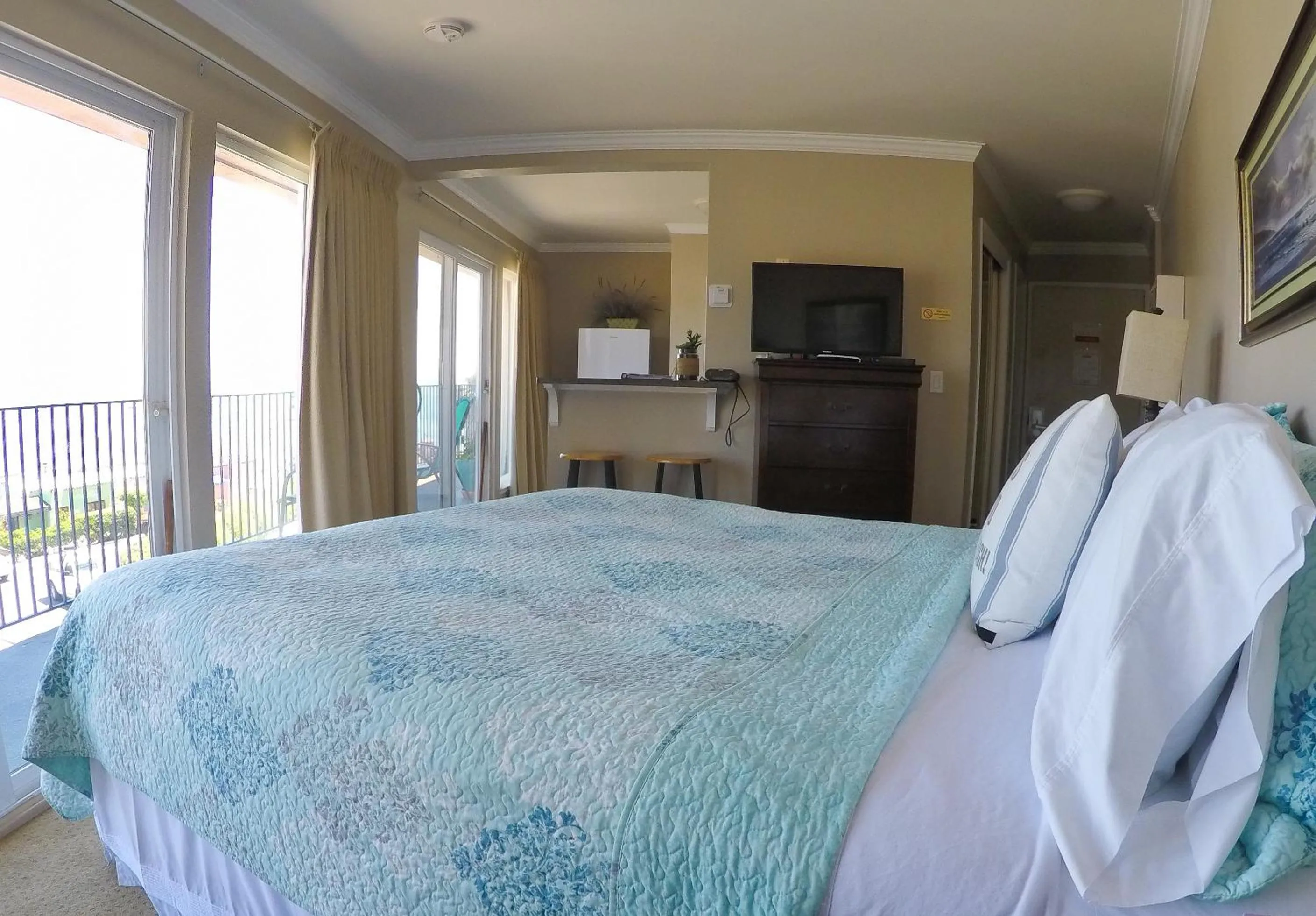 Bed in Capitola Beach Suites