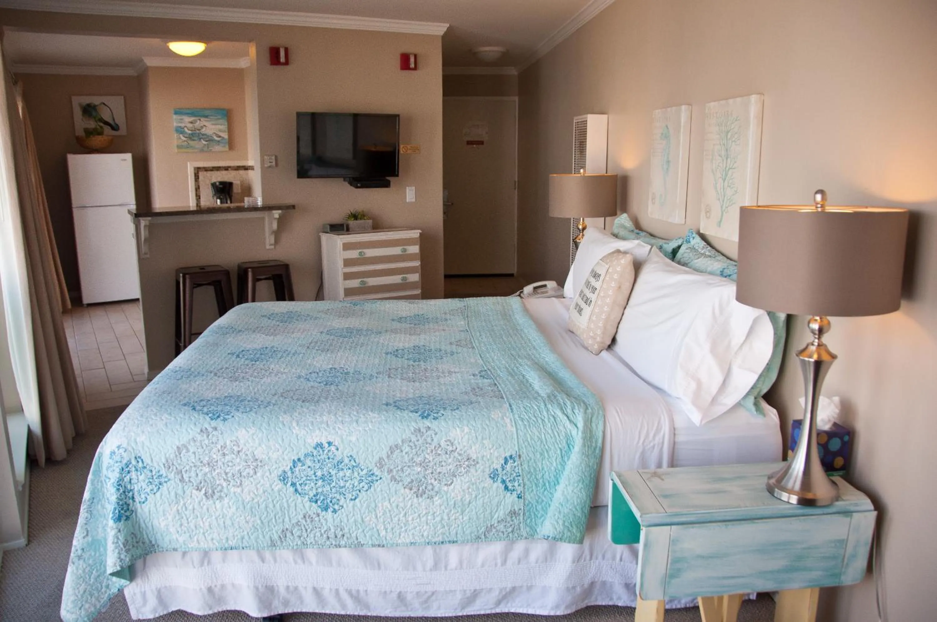 Bed in Capitola Beach Suites