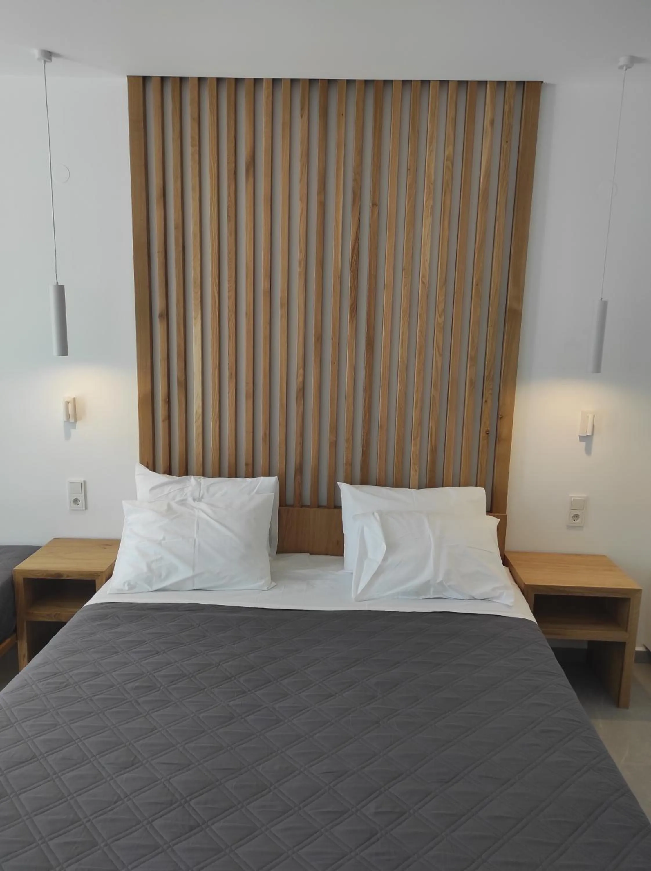 Bed in Melissa Apartments, Studios & Suites