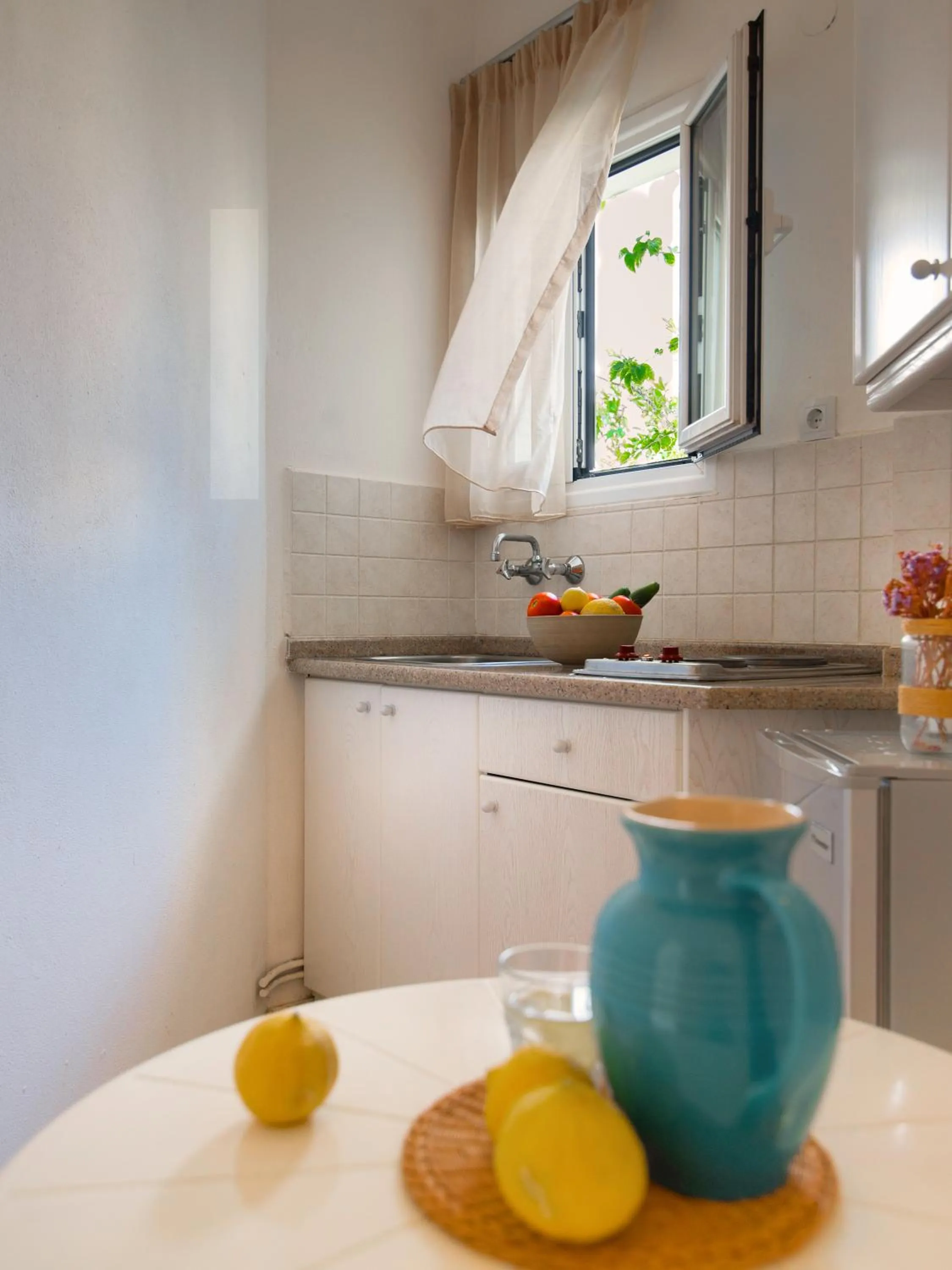 Kitchen or kitchenette in Melissa Apartments, Studios & Suites