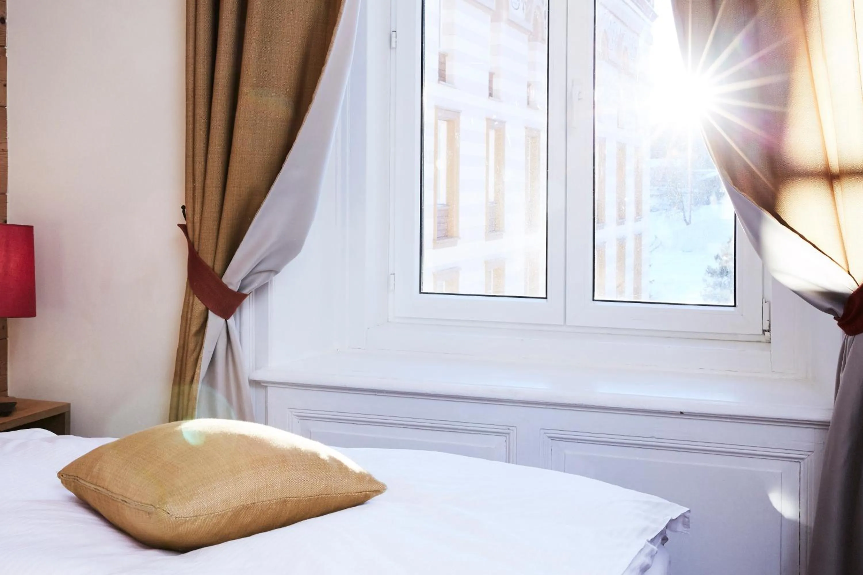 Bed in Maloja Palace Suites CO2-Neutral