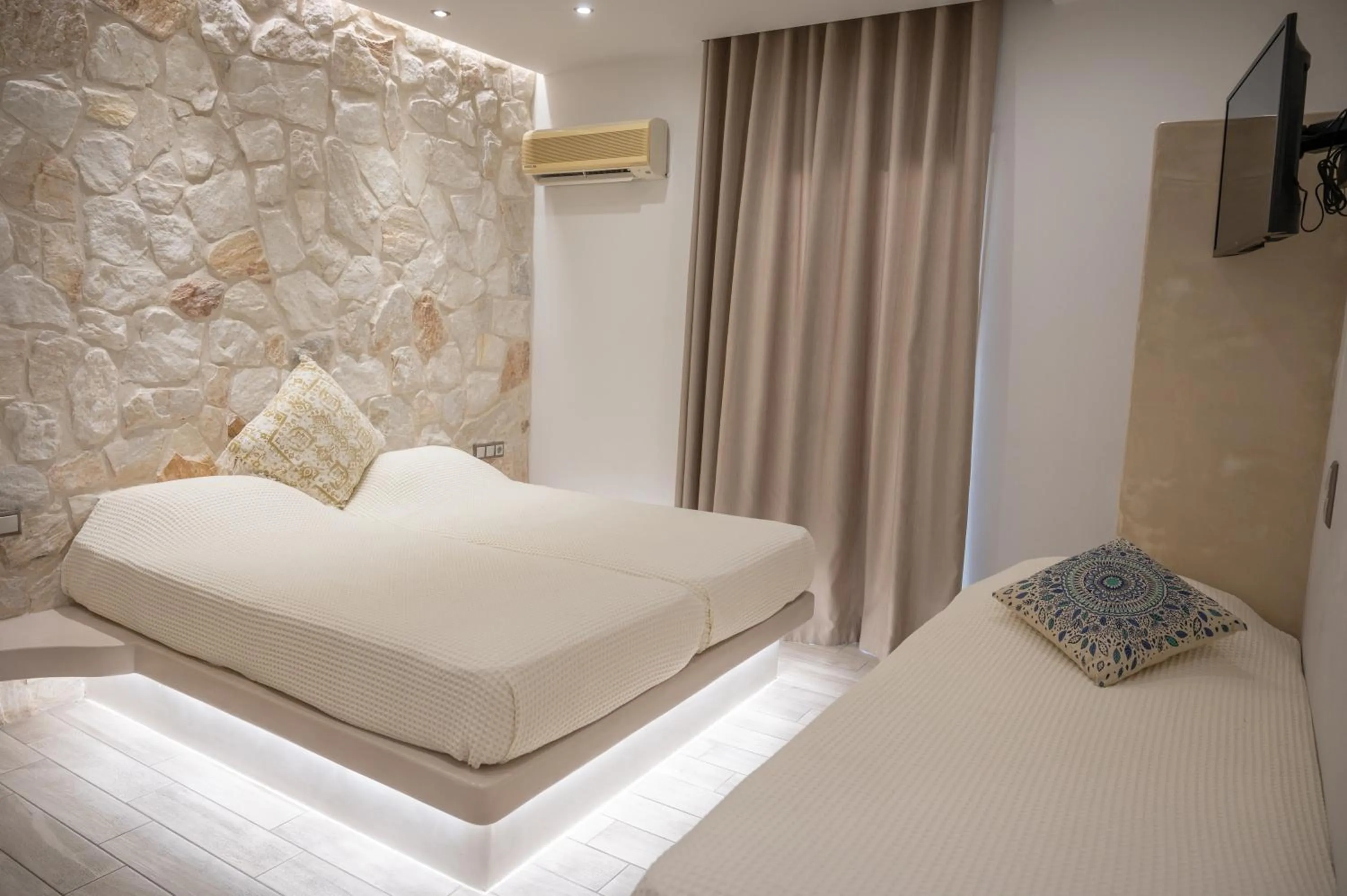 Bed in Katerina Roza Studios - Heartfelt Hospitality in the City