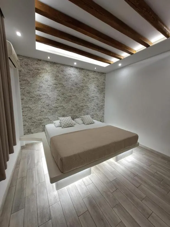 Bed in Katerina Roza Studios - Heartfelt Hospitality in the City