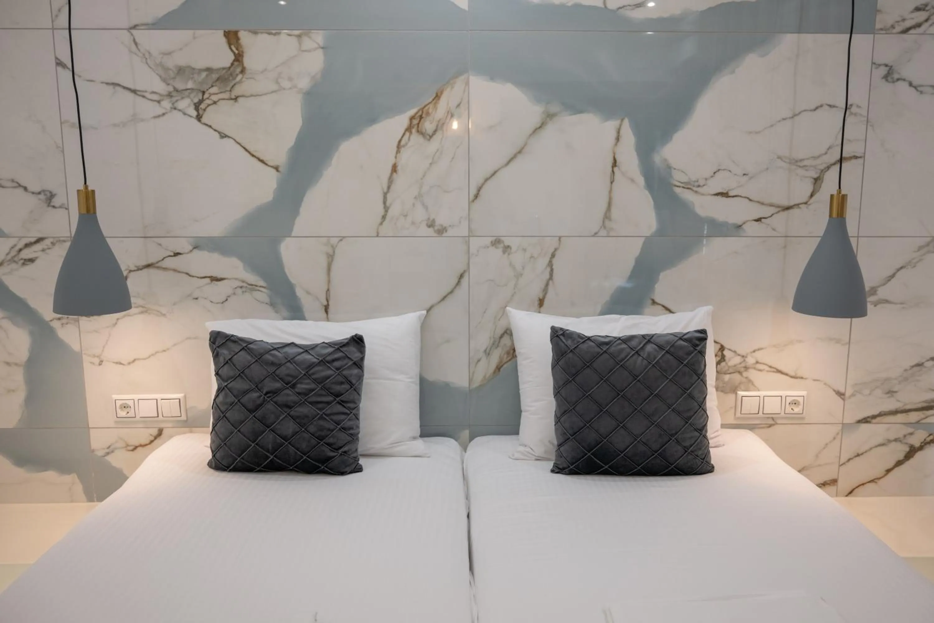 Bed in Katerina Roza Studios - Heartfelt Hospitality in the City