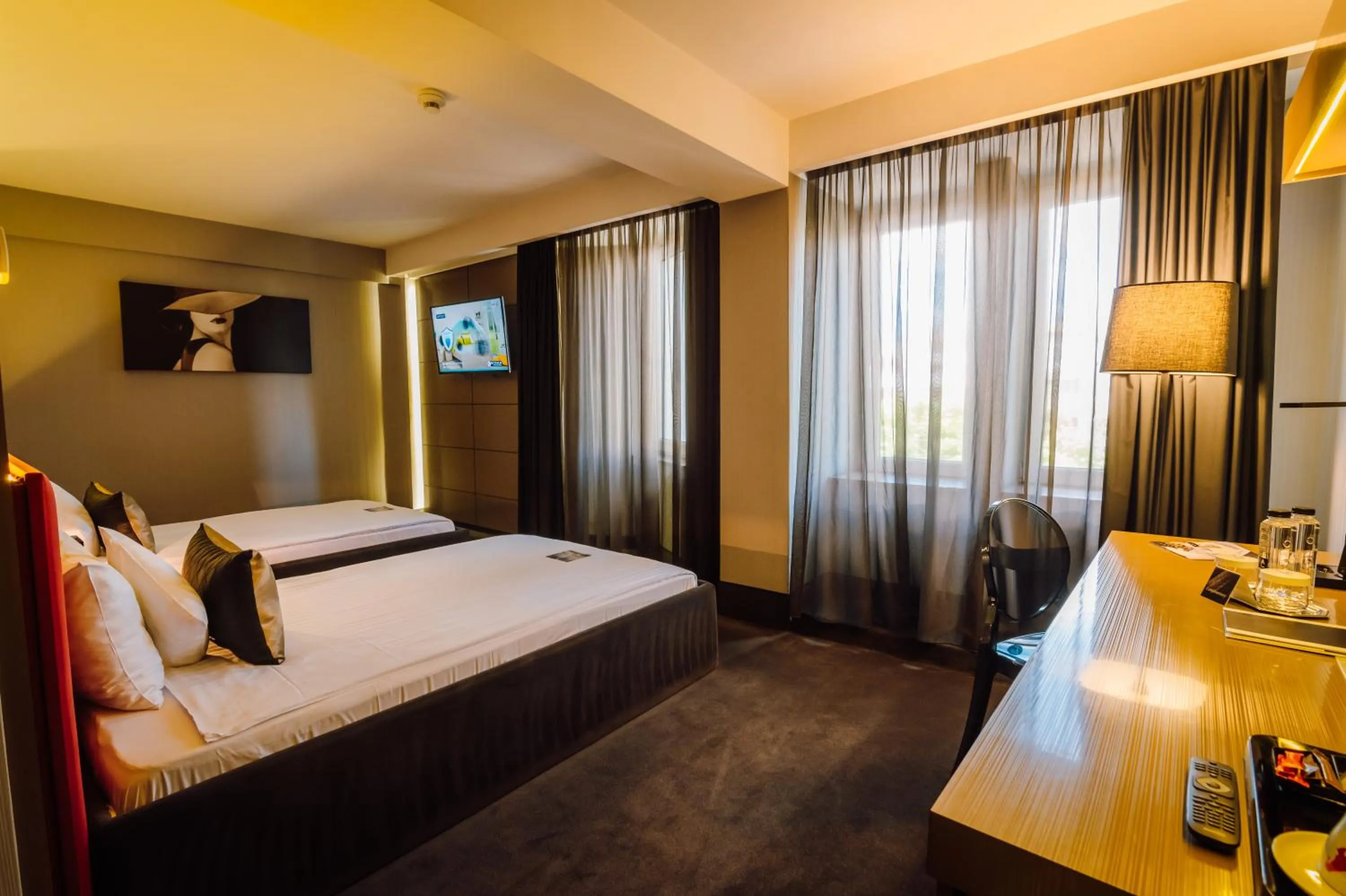 Bed in Plaza V Hotel