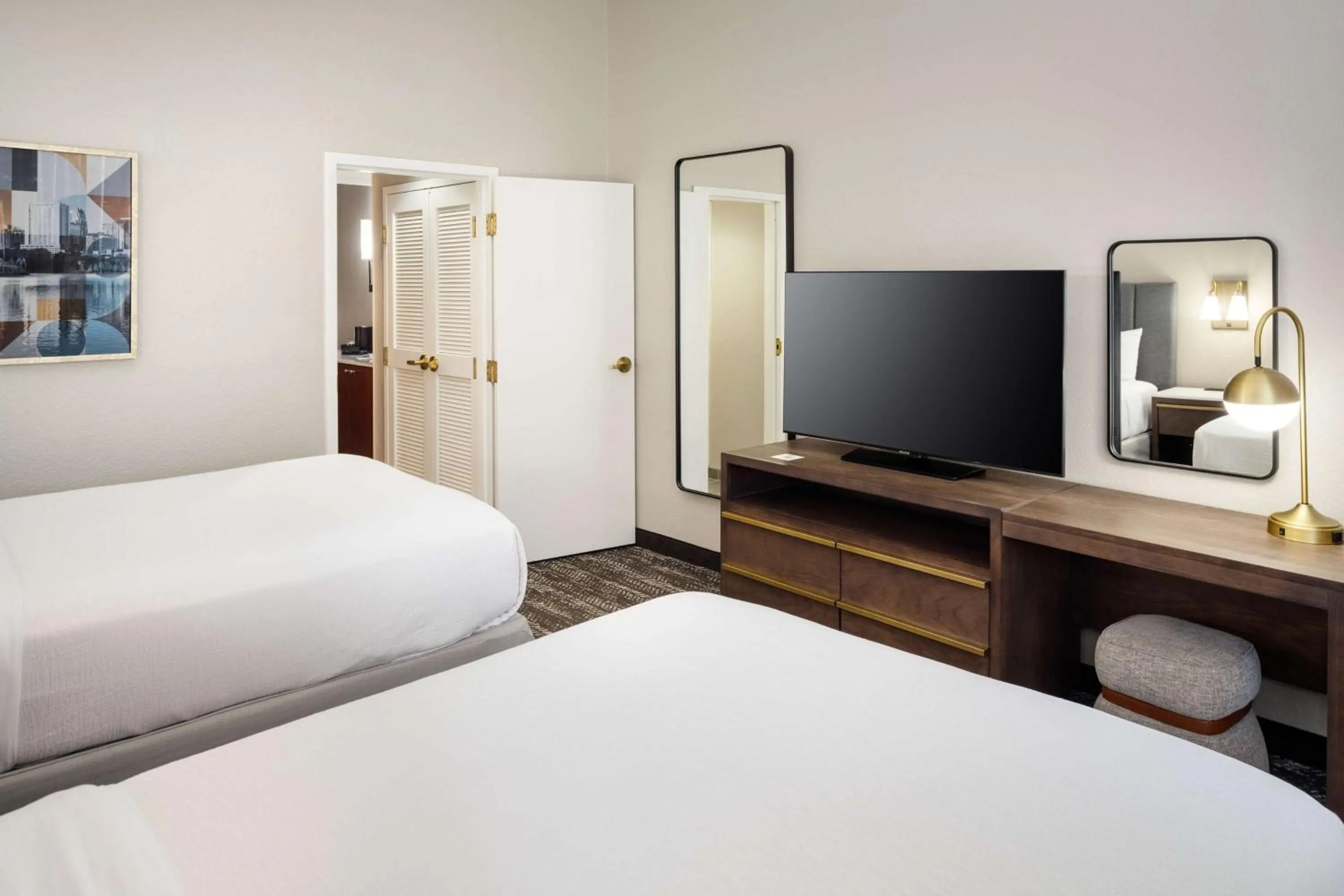 Bed in Embassy Suites by Hilton Orlando North