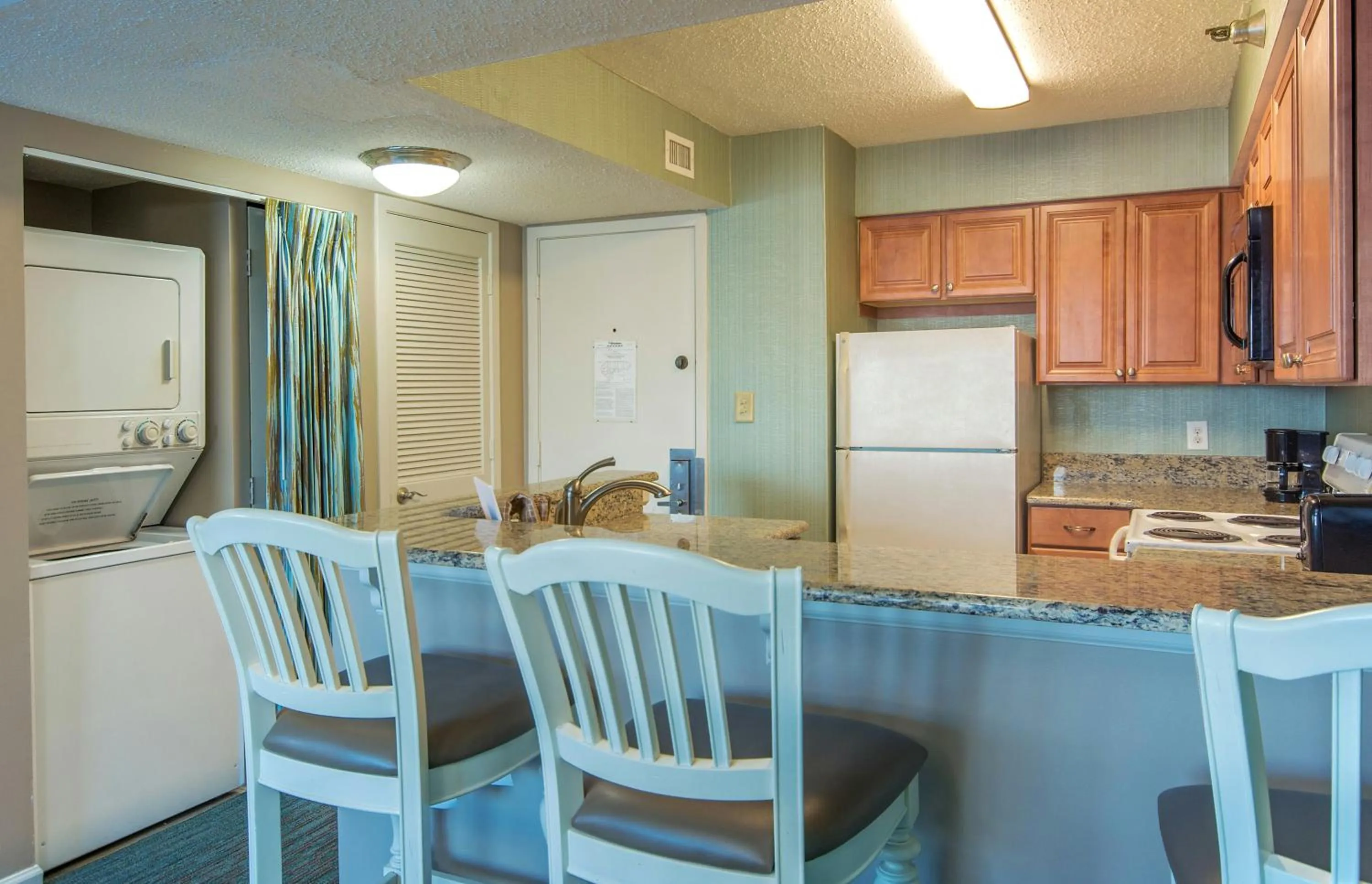 Kitchen or kitchenette in The Strand - A Boutique Resort