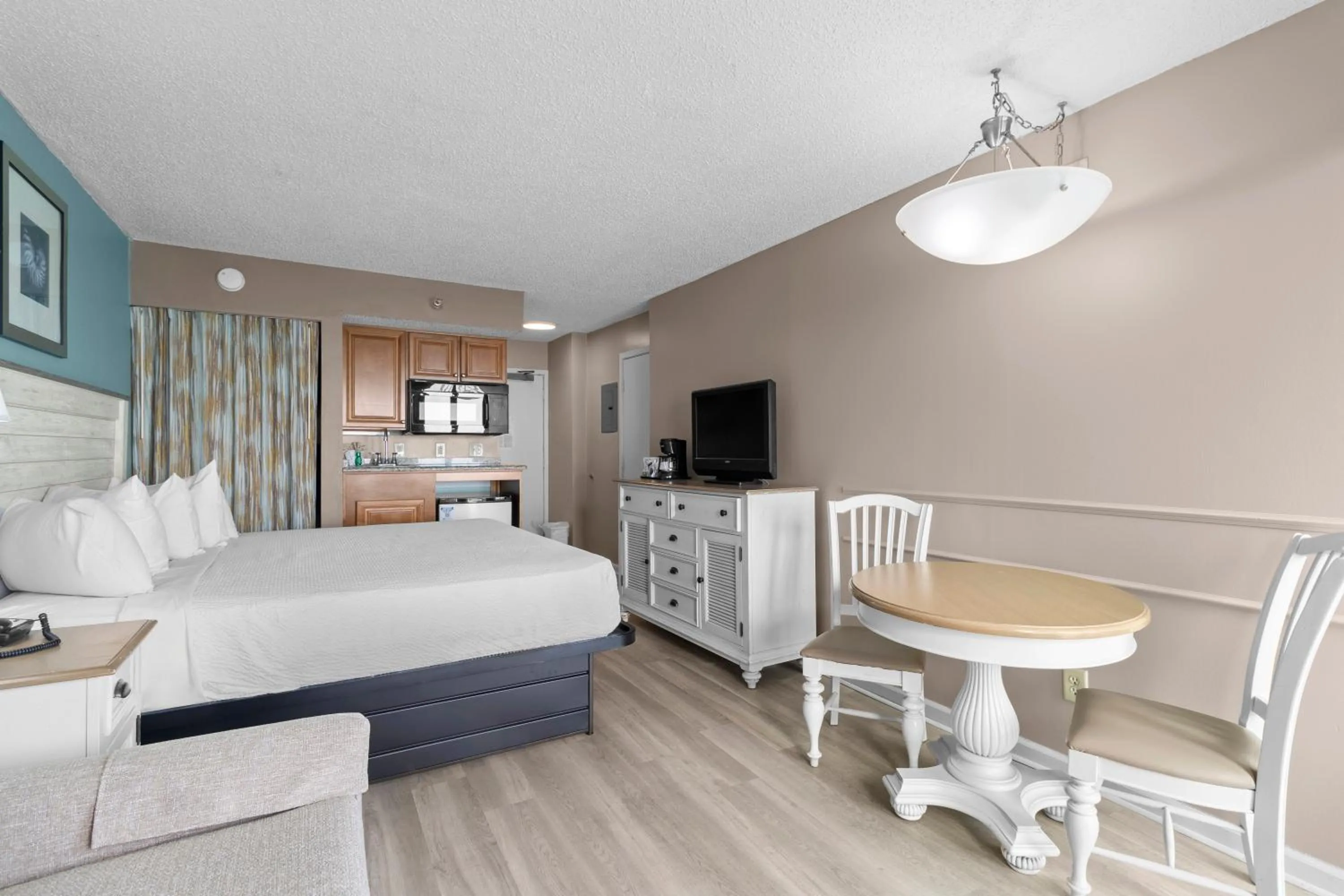 Bedroom, Bed in The Strand - A Boutique Resort