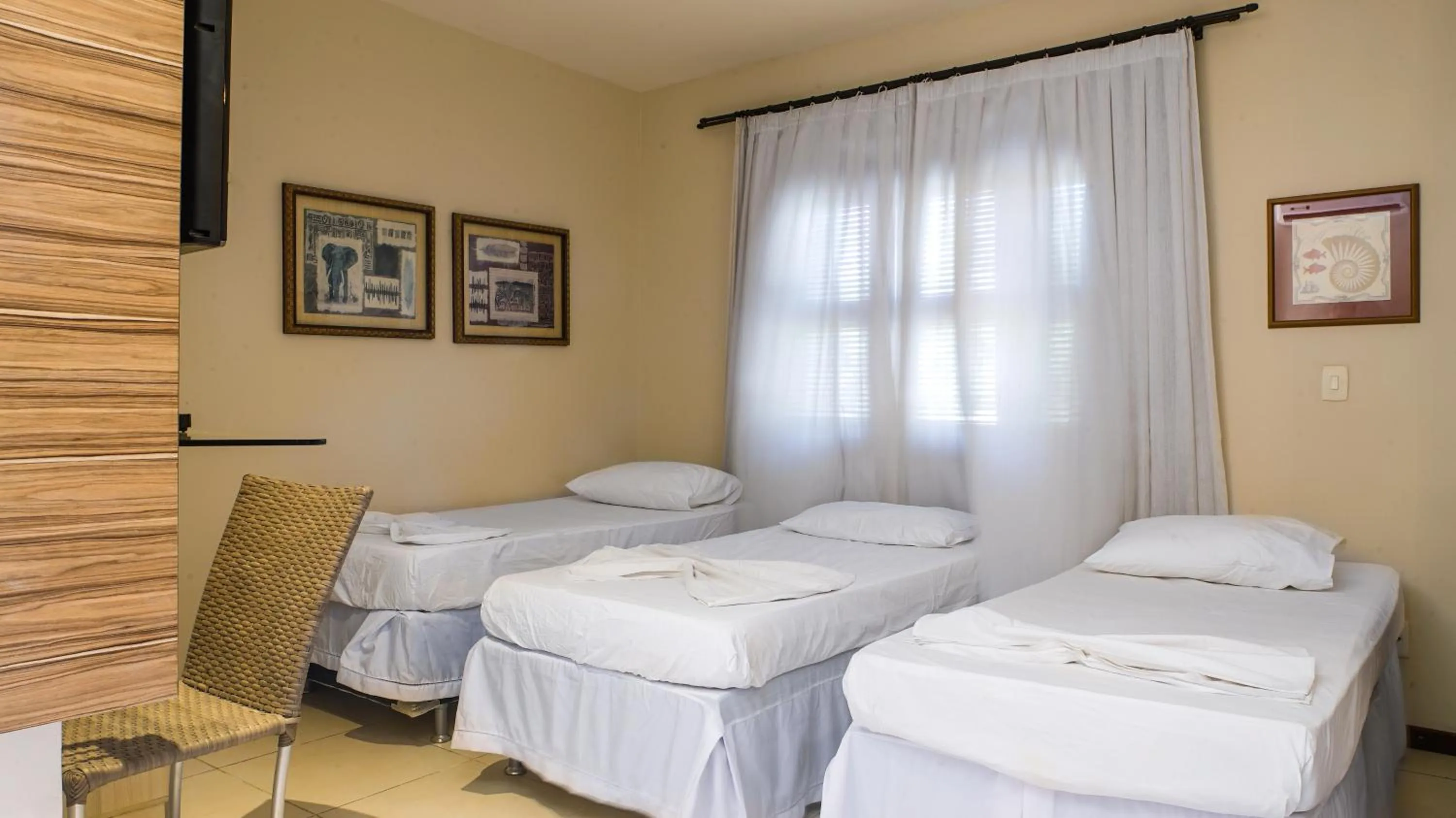 Bed in Kanaloa Pousada