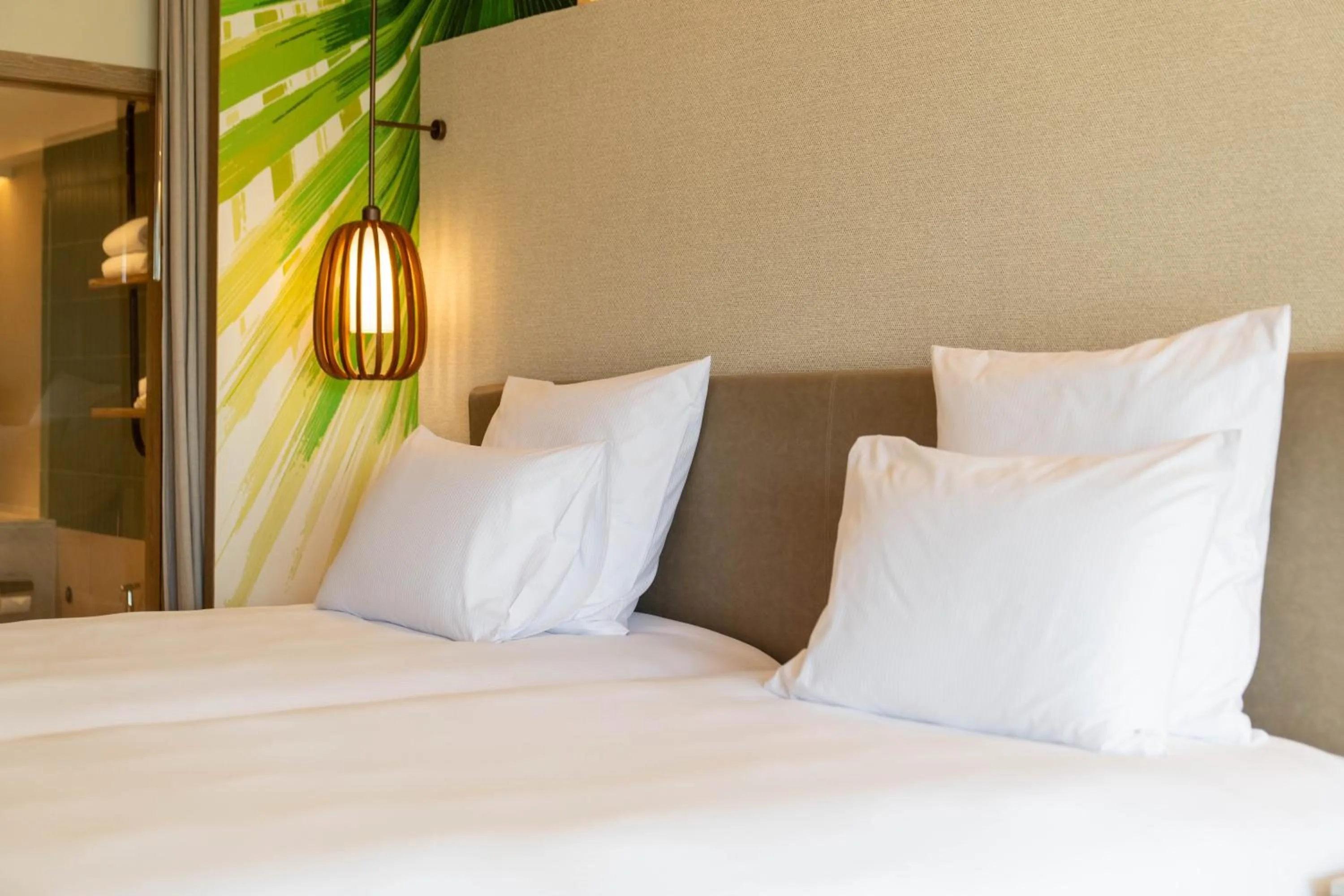 Bed in Pullman Phuket Karon Beach Resort