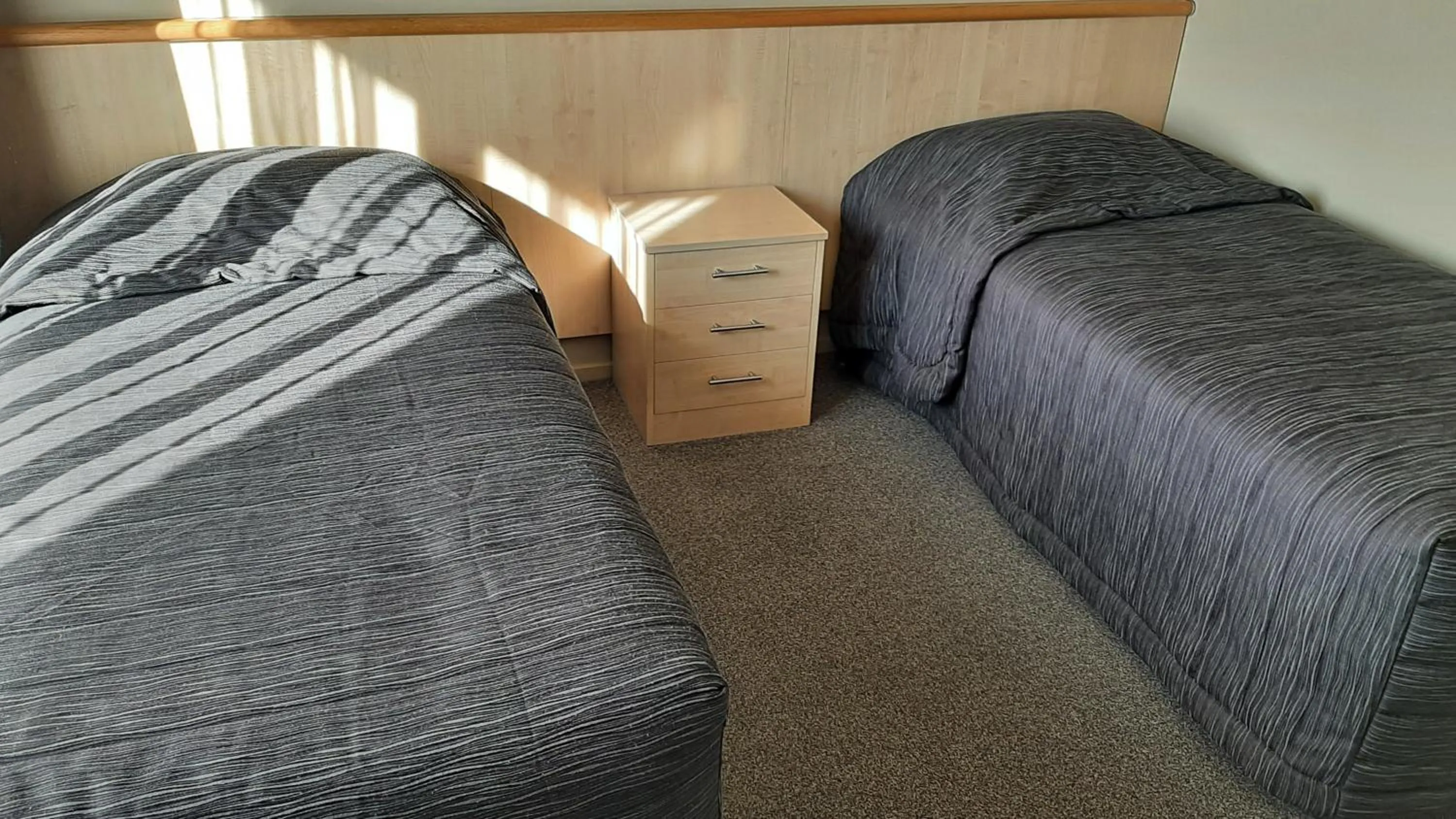 Bed in Kaikoura Gateway Motor Lodge