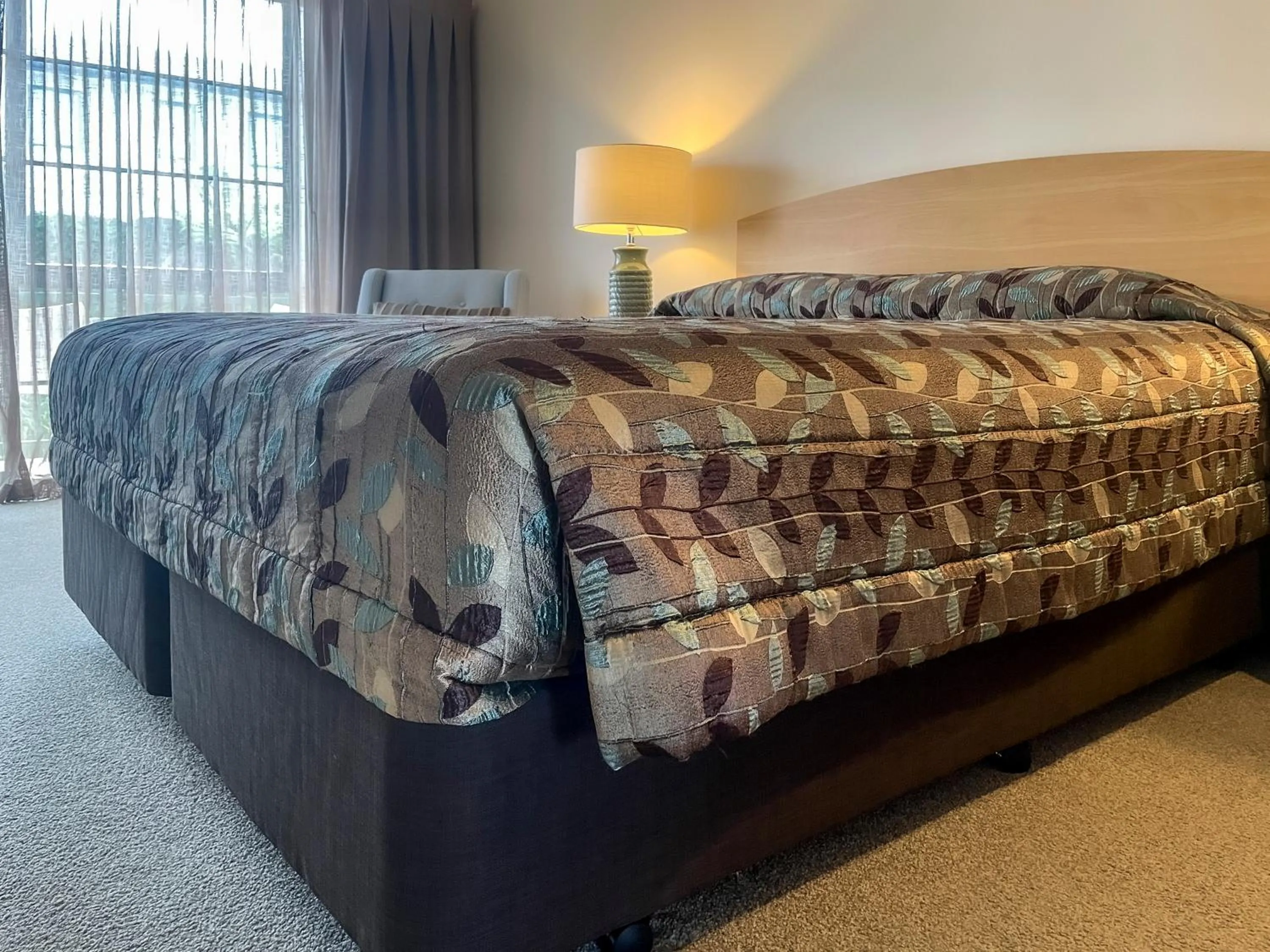 Bed in Greenlane Manor Motel