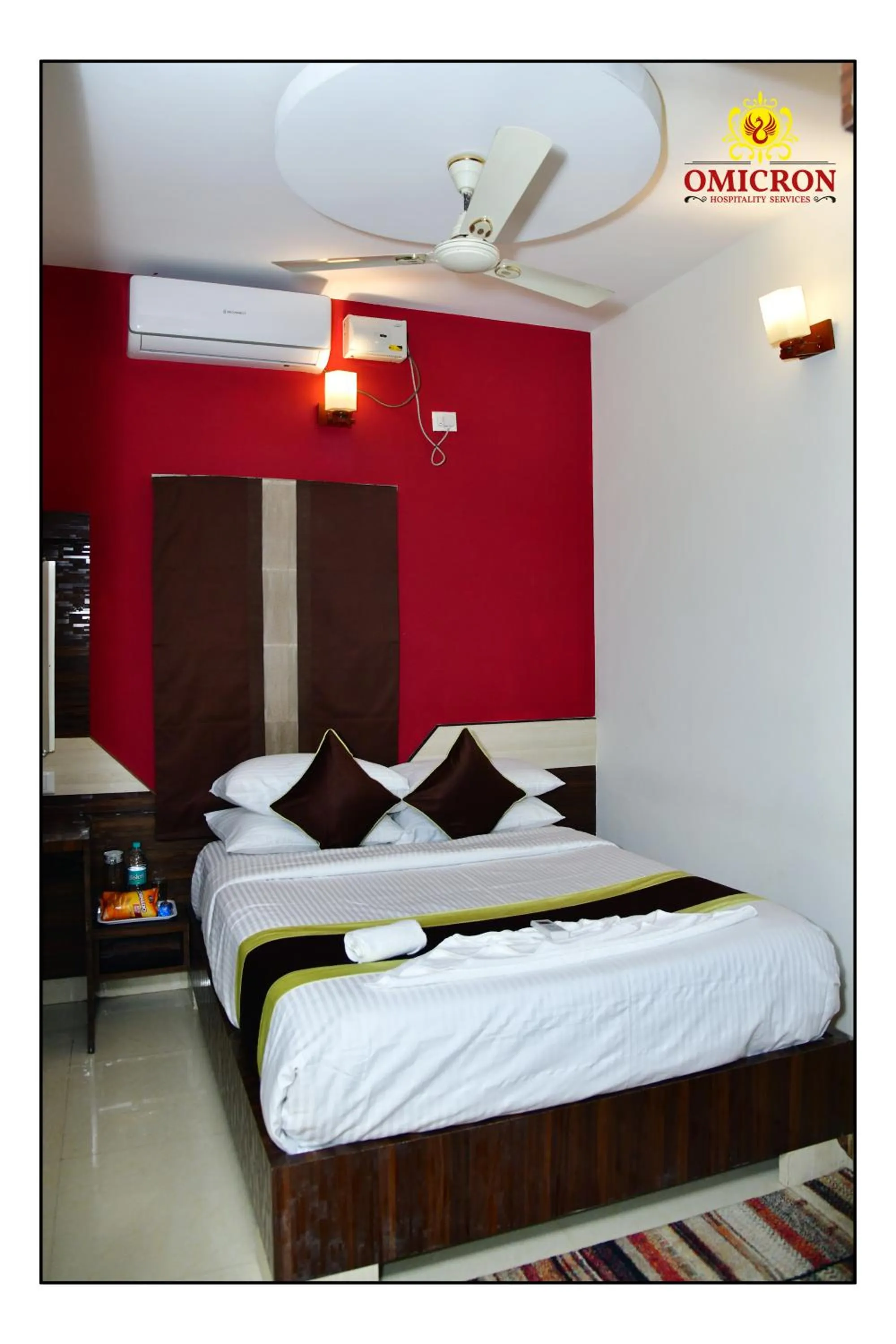 Bed in Hotel Omicron 1 BHK Studio room