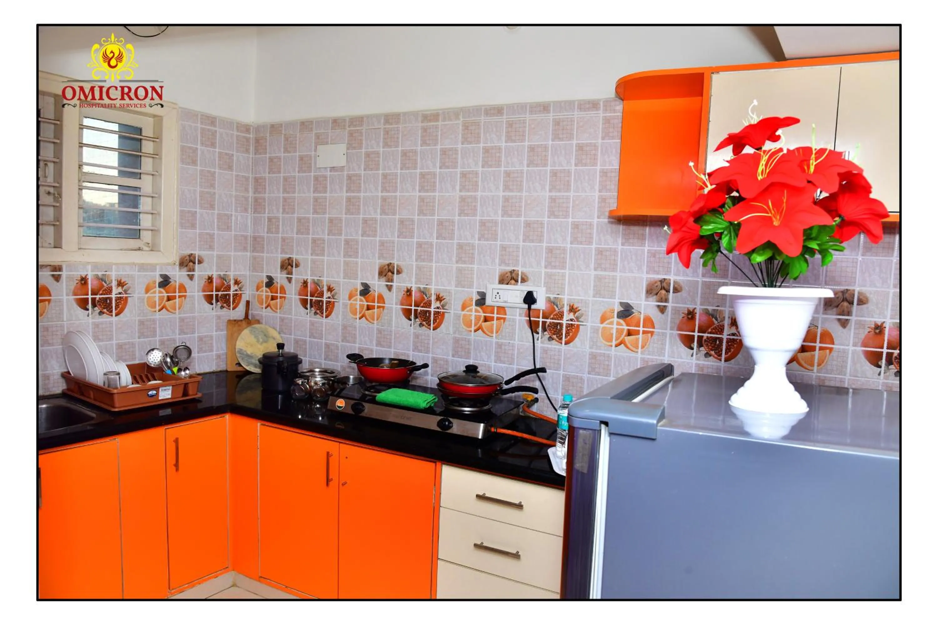 Kitchen or kitchenette in Hotel Omicron 1 BHK Studio room