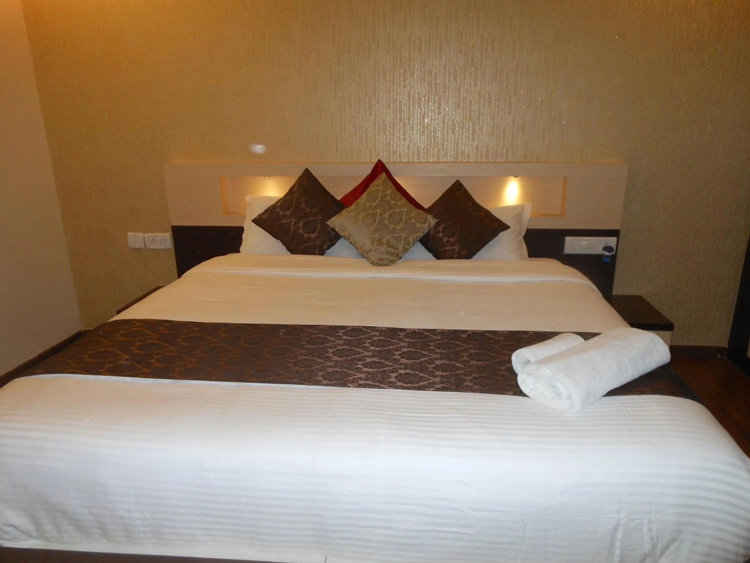 Bed in Hotel Omicron 1 BHK Studio room