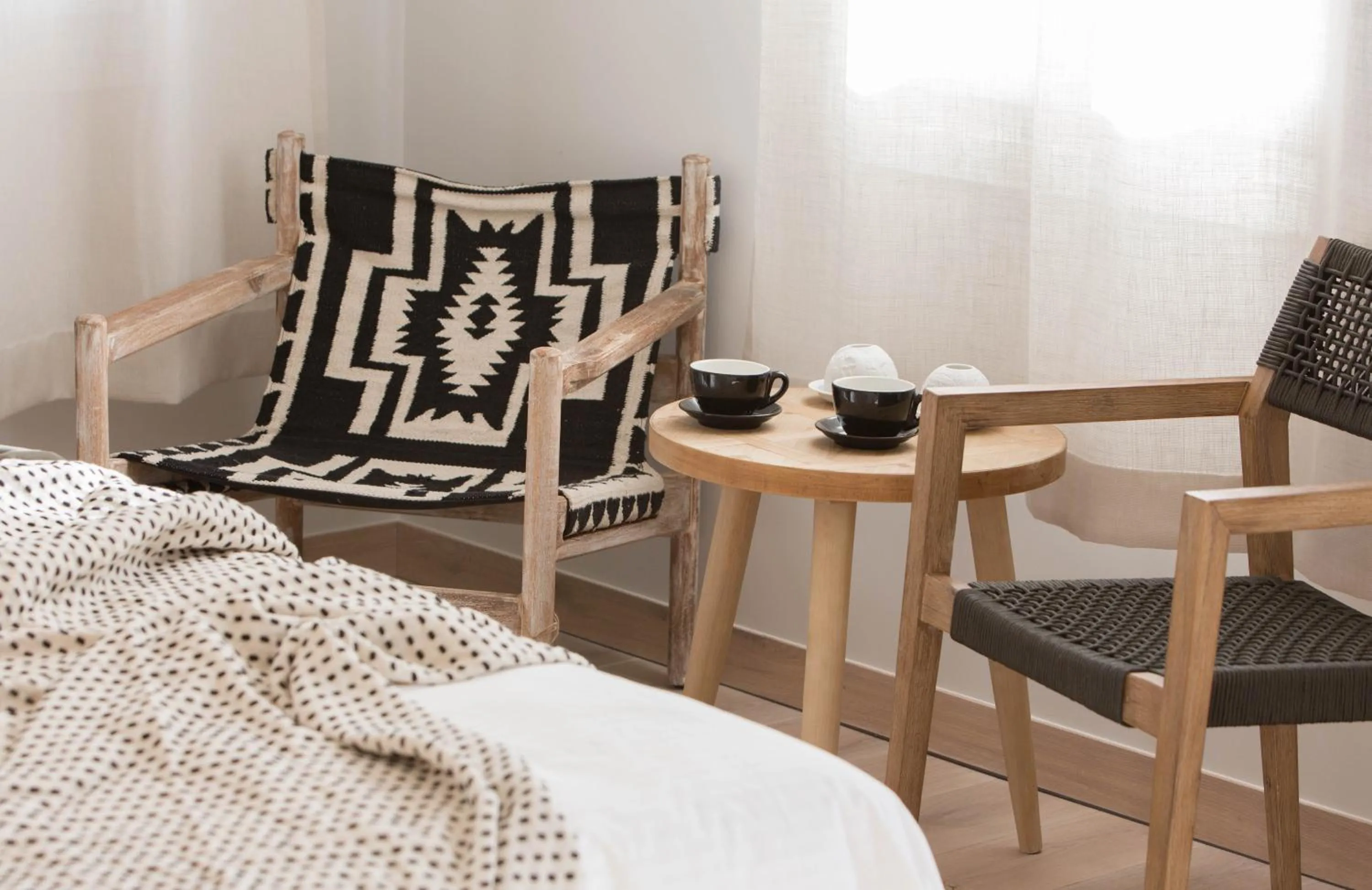 Seating area, Bed in Amymone Suites