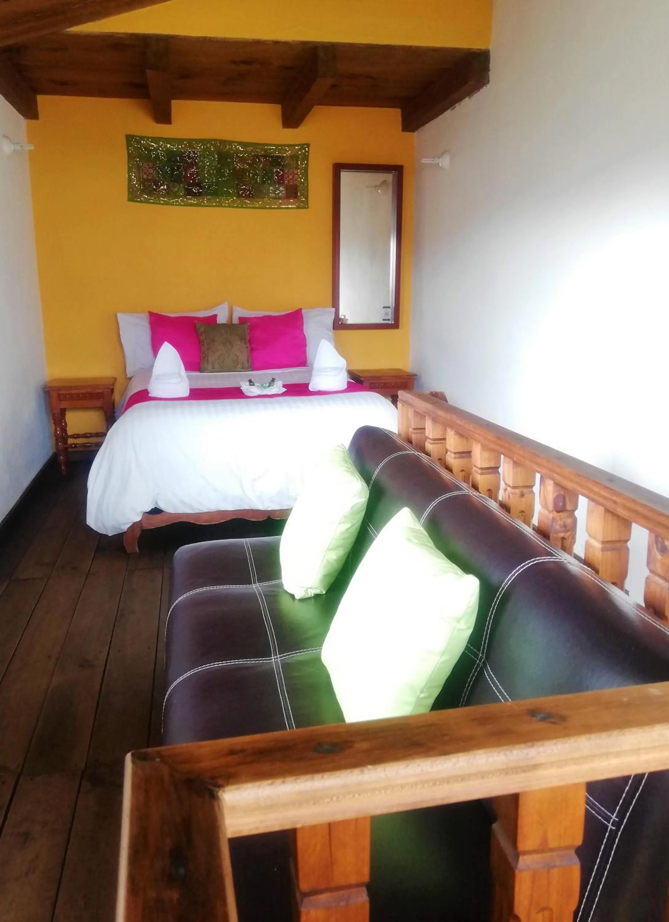 Living room, Bed in Ganesha Hotel