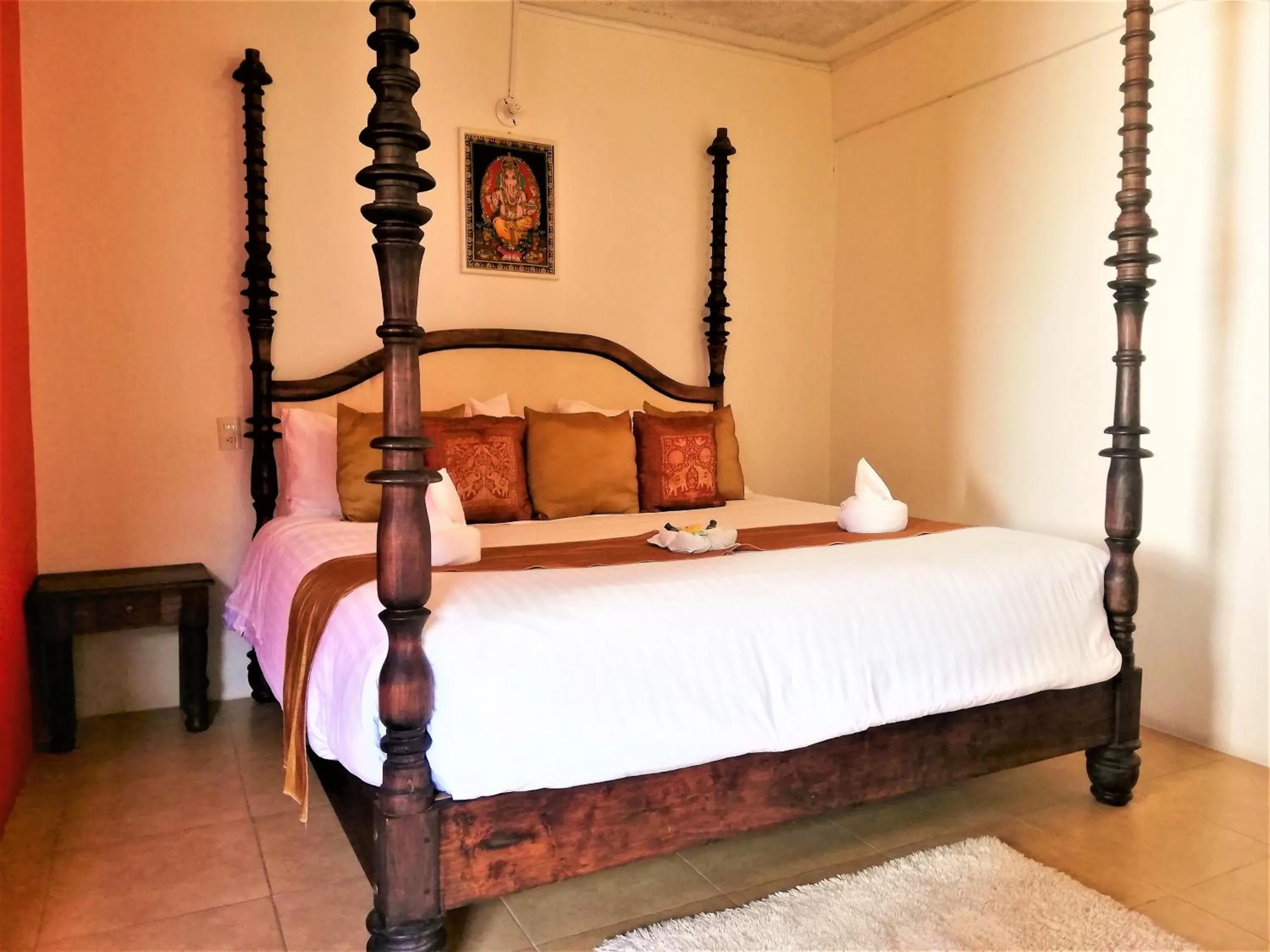 Bed in Ganesha Hotel
