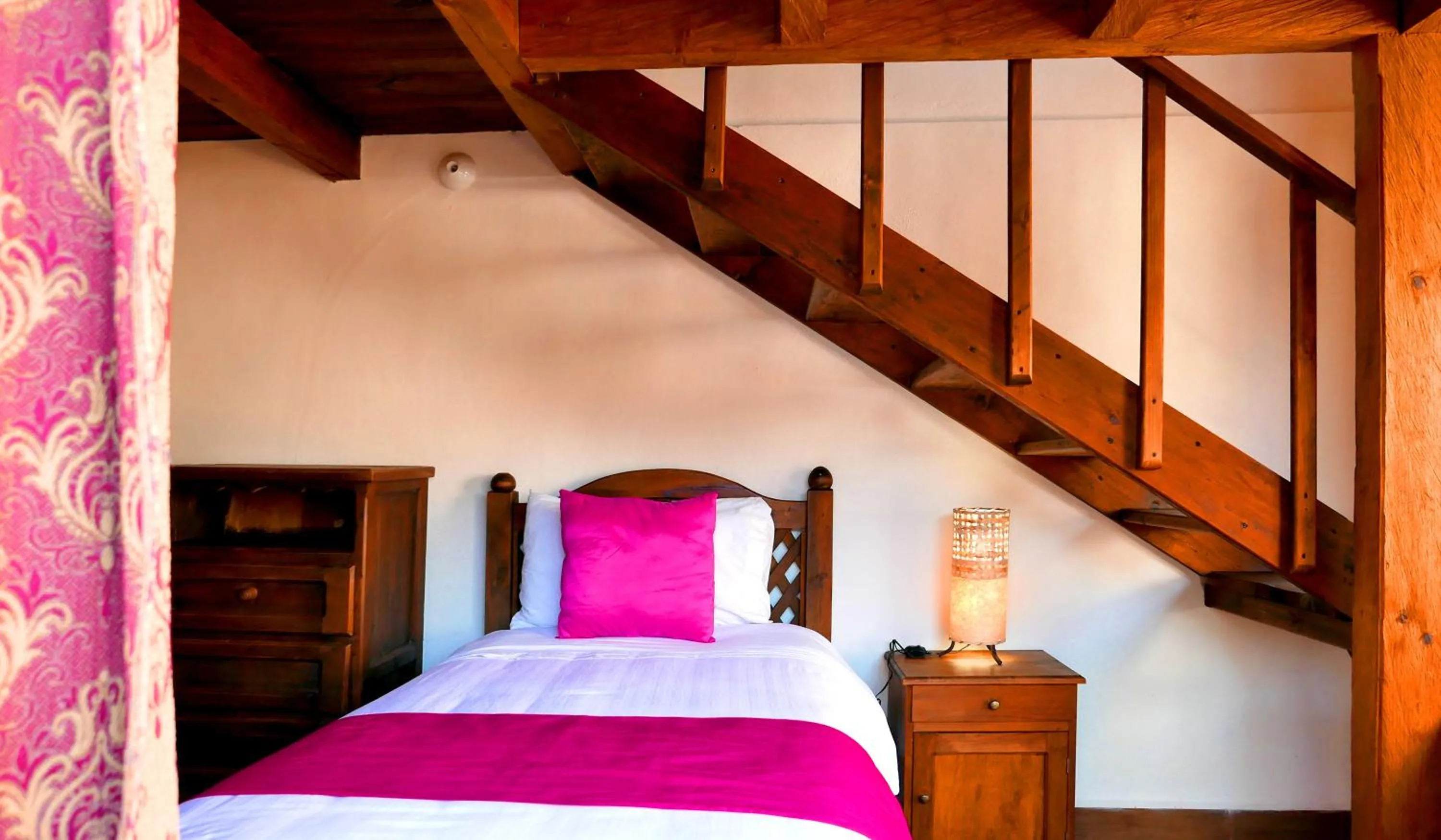 Bed in Ganesha Hotel