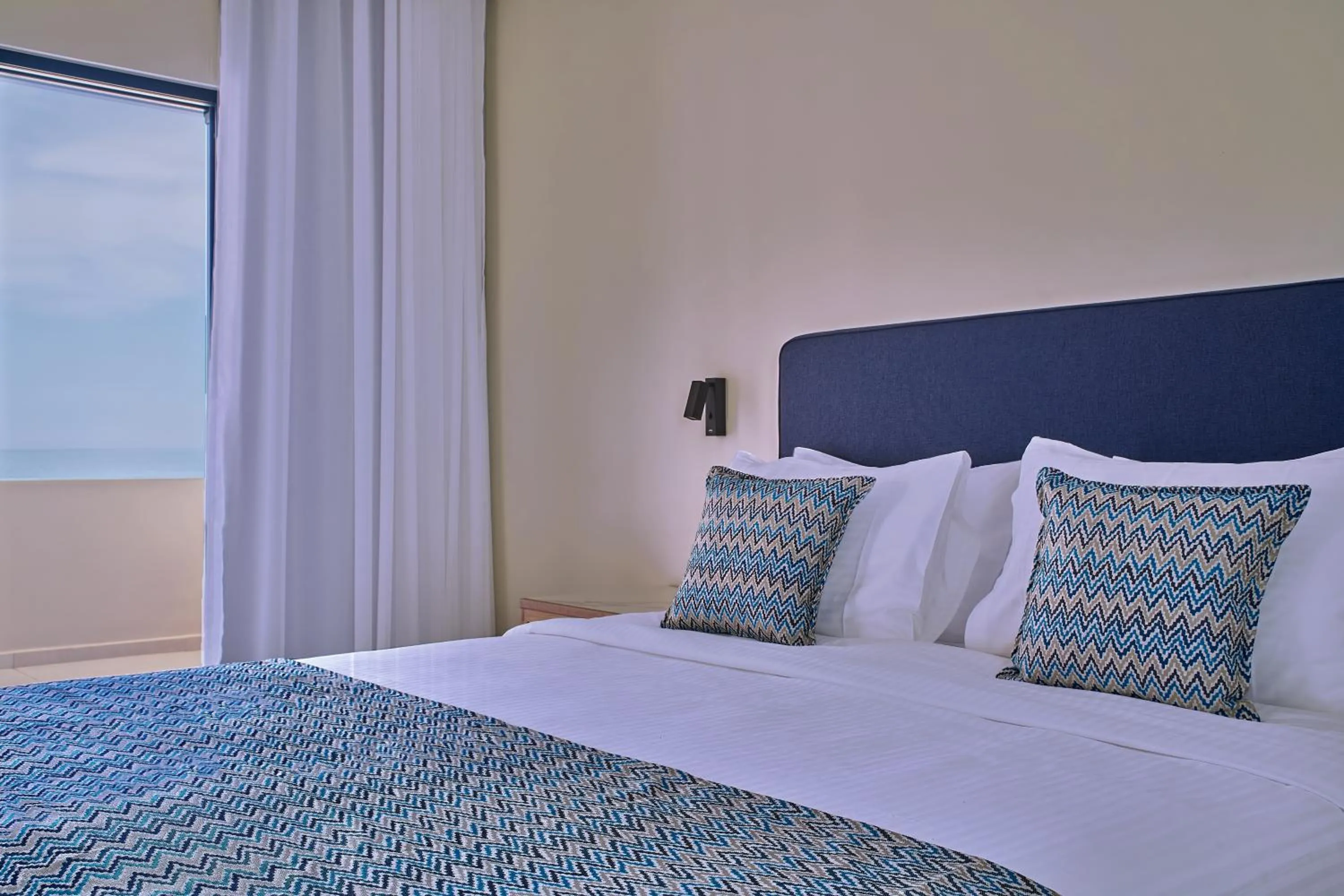 Bed in Silver Beach Hotel & Apartments