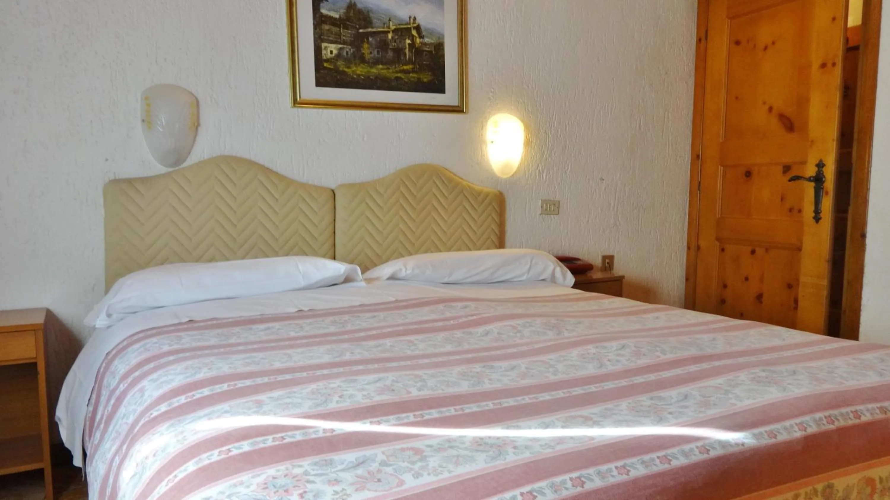 Bed in Hotel Piccolo Mondo