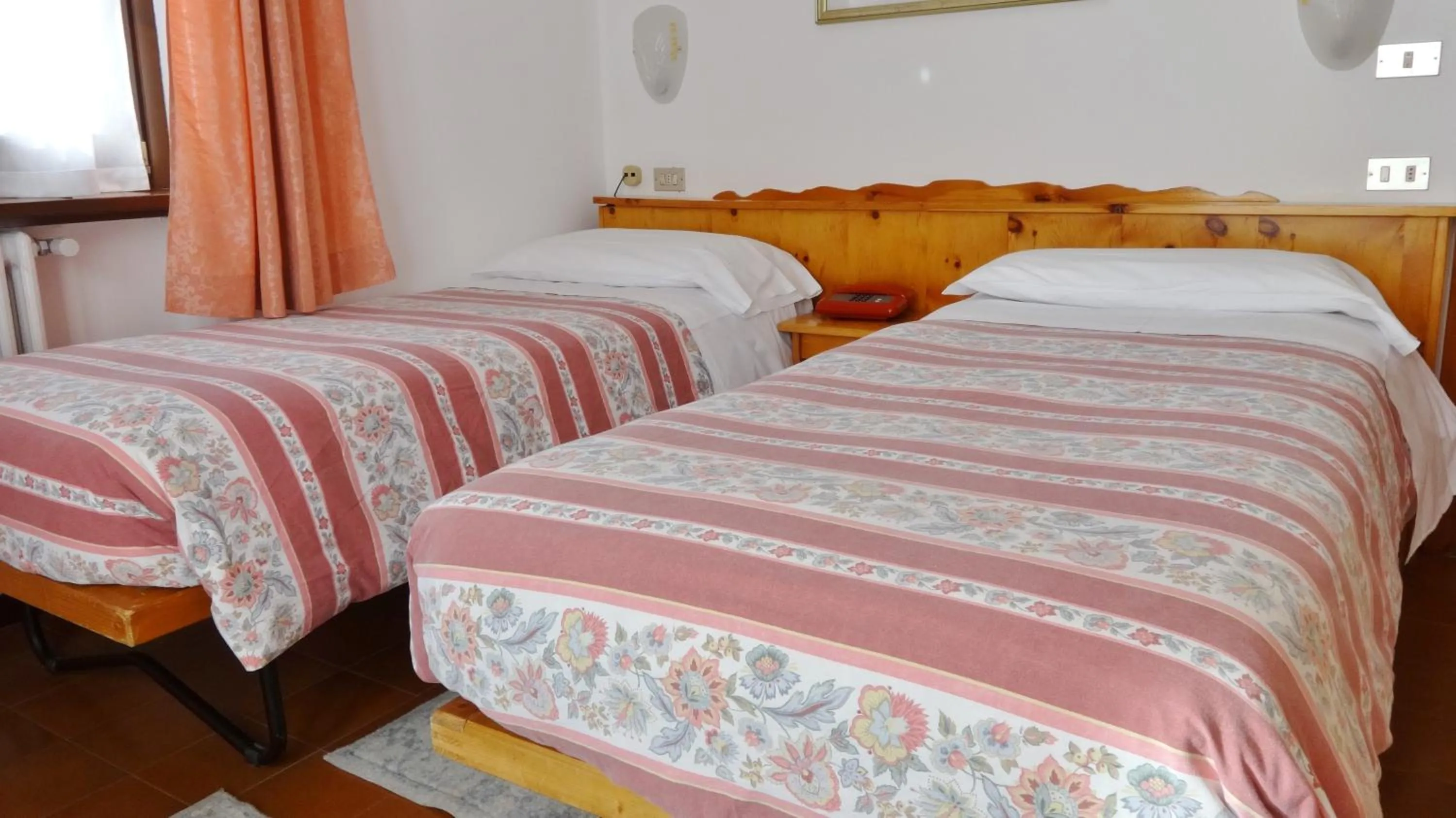 Bed in Hotel Piccolo Mondo