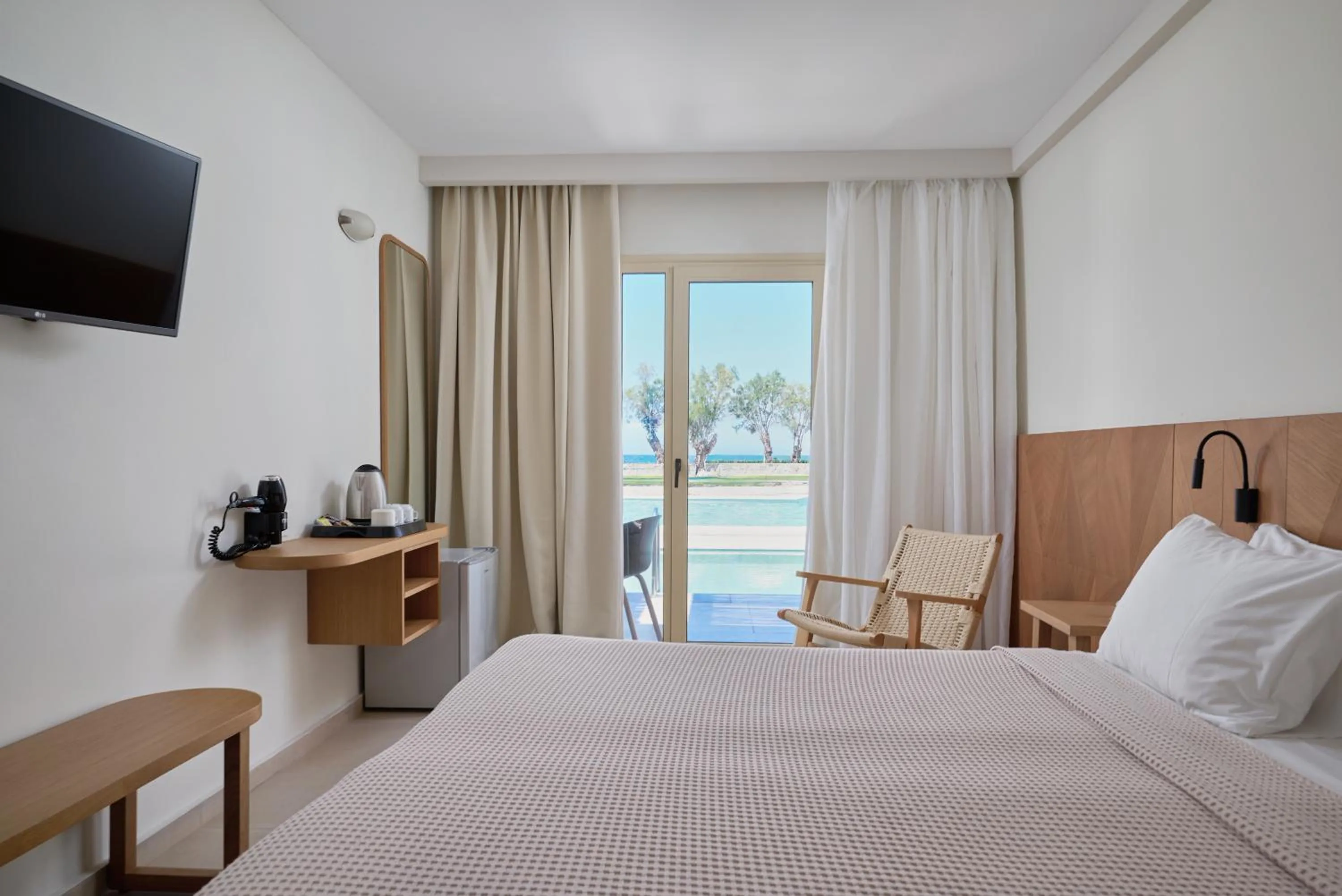 Bed in Malia Bay Beach Hotel & Bungalows