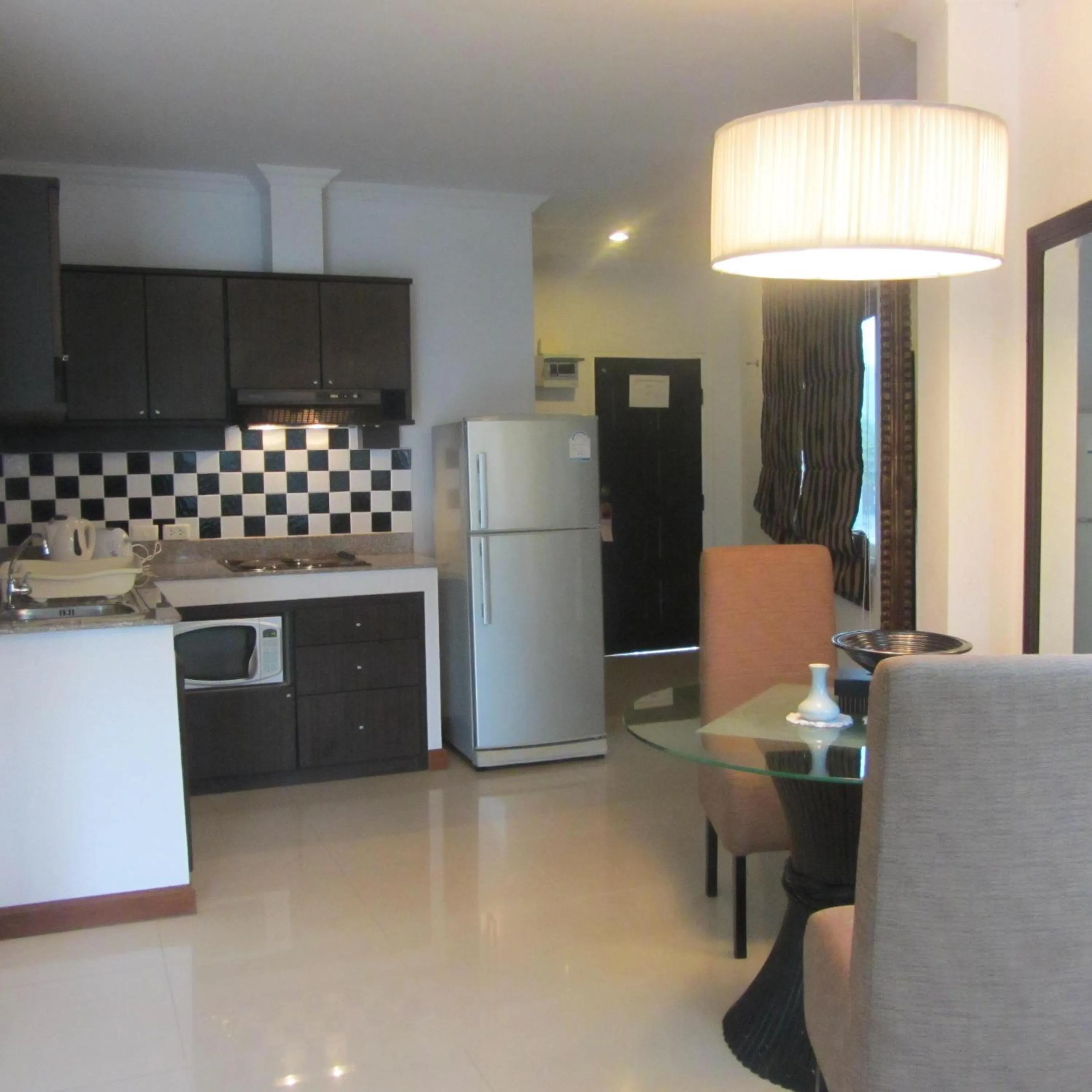 Kitchen or kitchenette in Orchid Kathu Heights Service Apartments