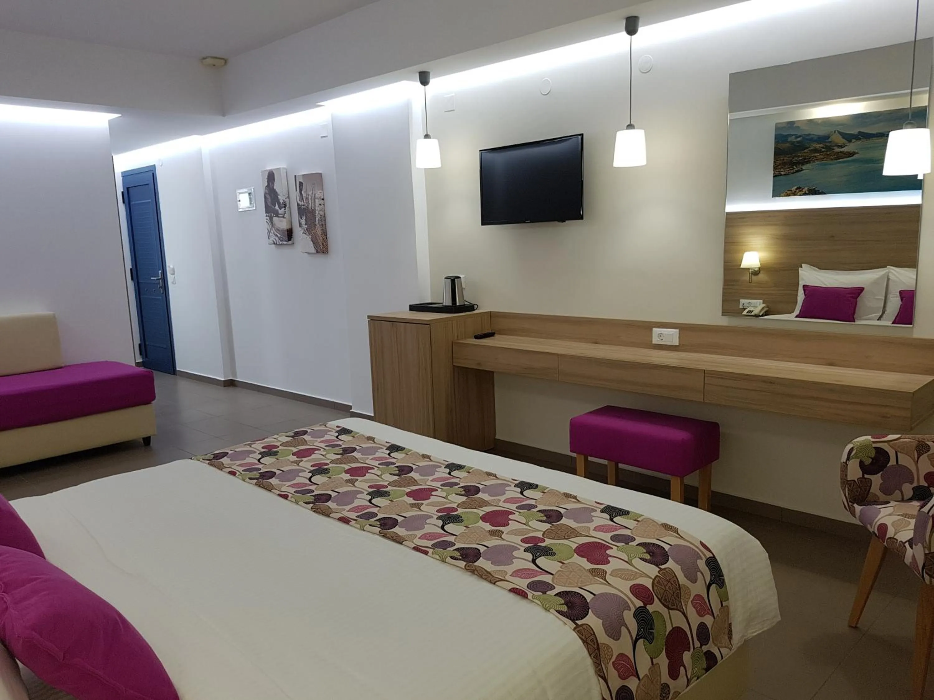 Bed in Astra Village & Suites