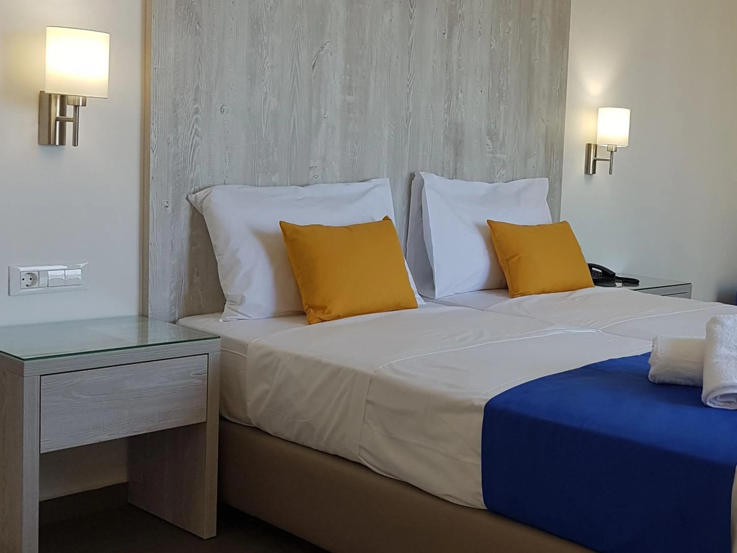 Bed in Astra Village & Suites
